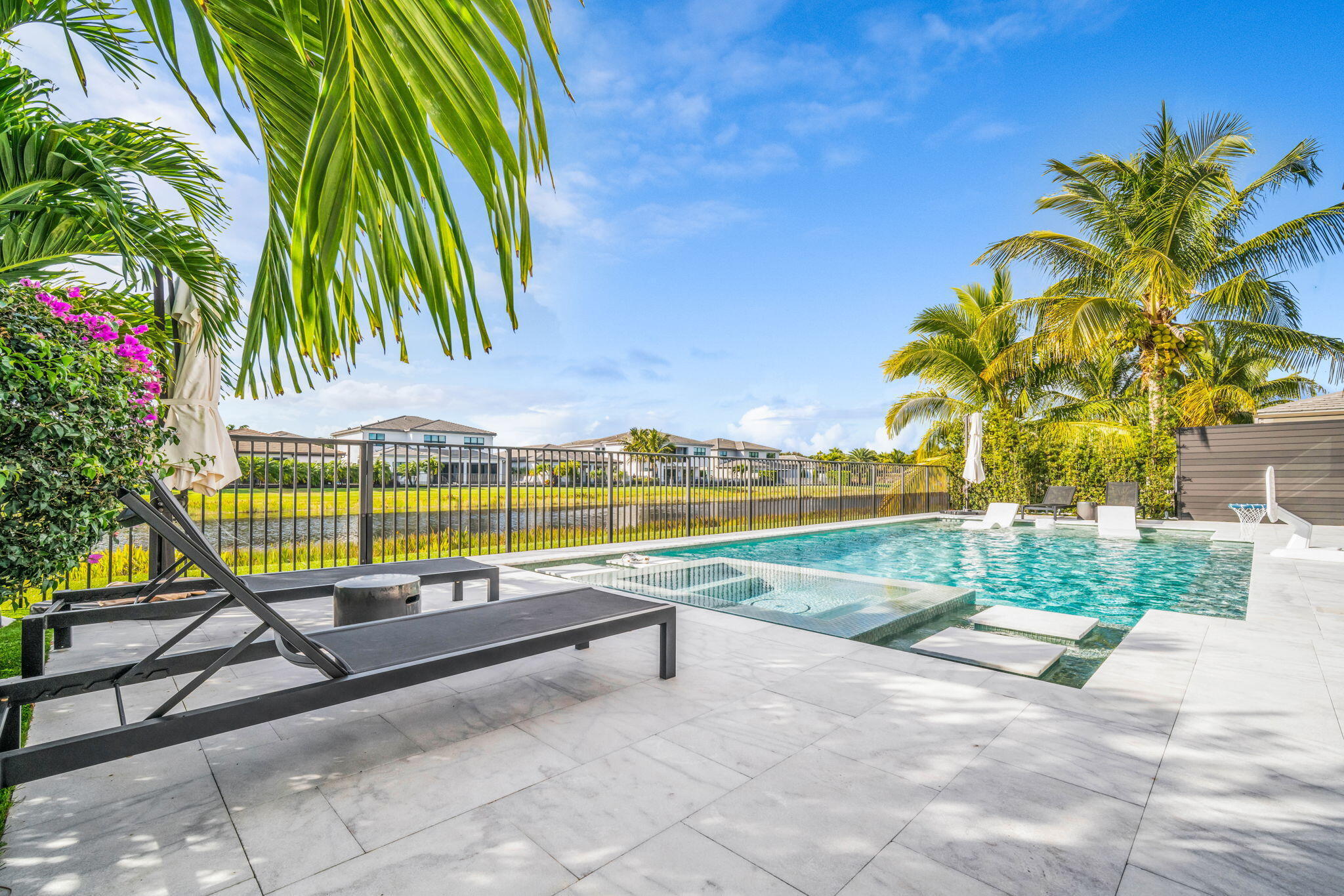 17059 Rainbow Fls Trail Boca Raton, FL 33496 - Photo 46 of 79 a view of swimming pool with a patio and a yard