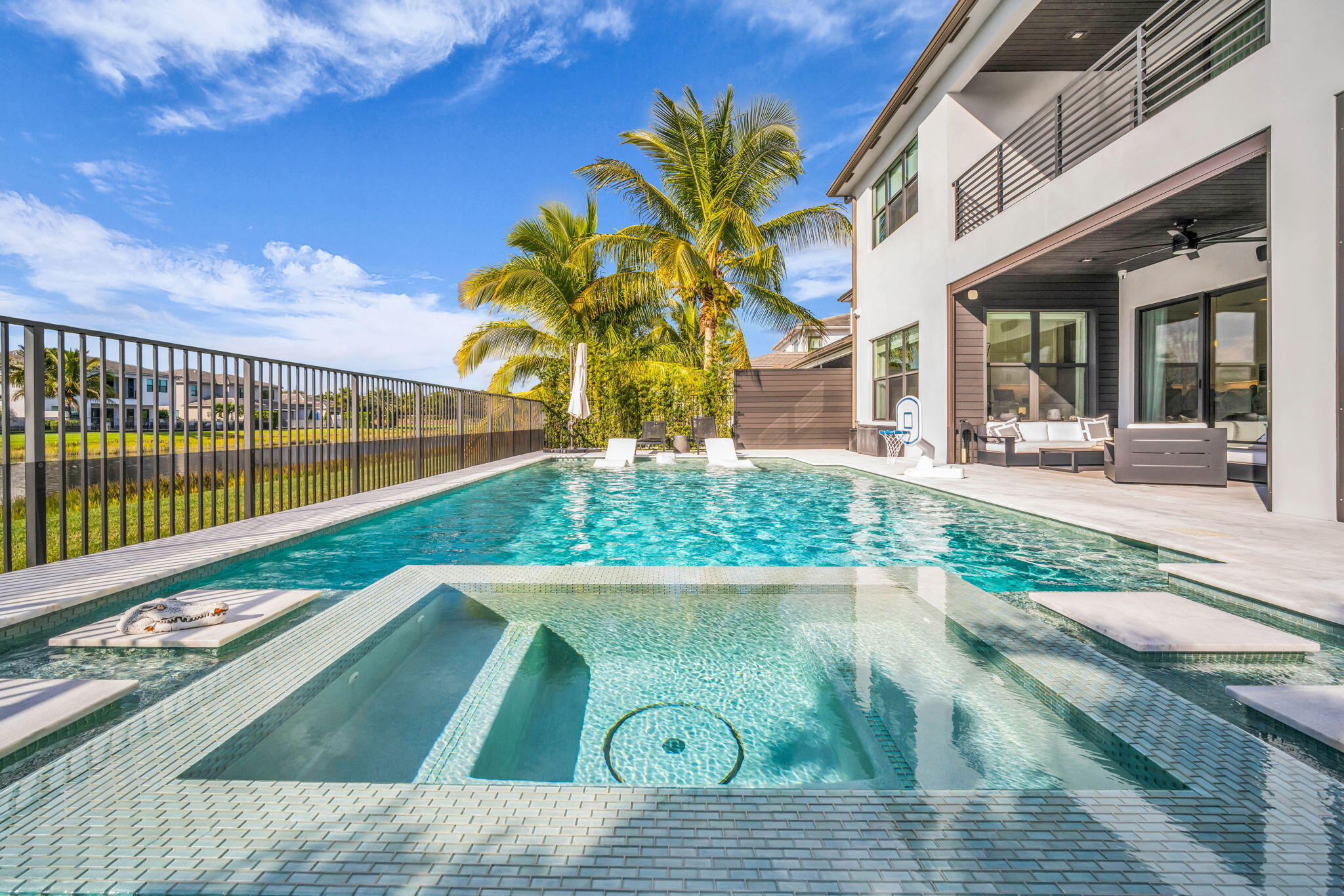 17059 Rainbow Fls Trail Boca Raton, FL 33496 - Photo 50 of 79 a view of a house with a swimming pool