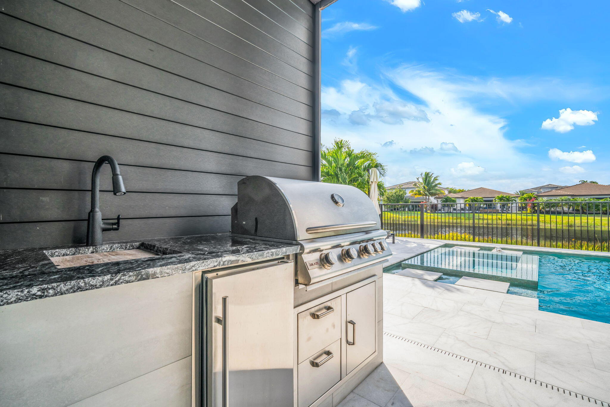 17059 Rainbow Fls Trail Boca Raton, FL 33496 - Photo 53 of 79 a view of a kitchen with a sink and dishwasher