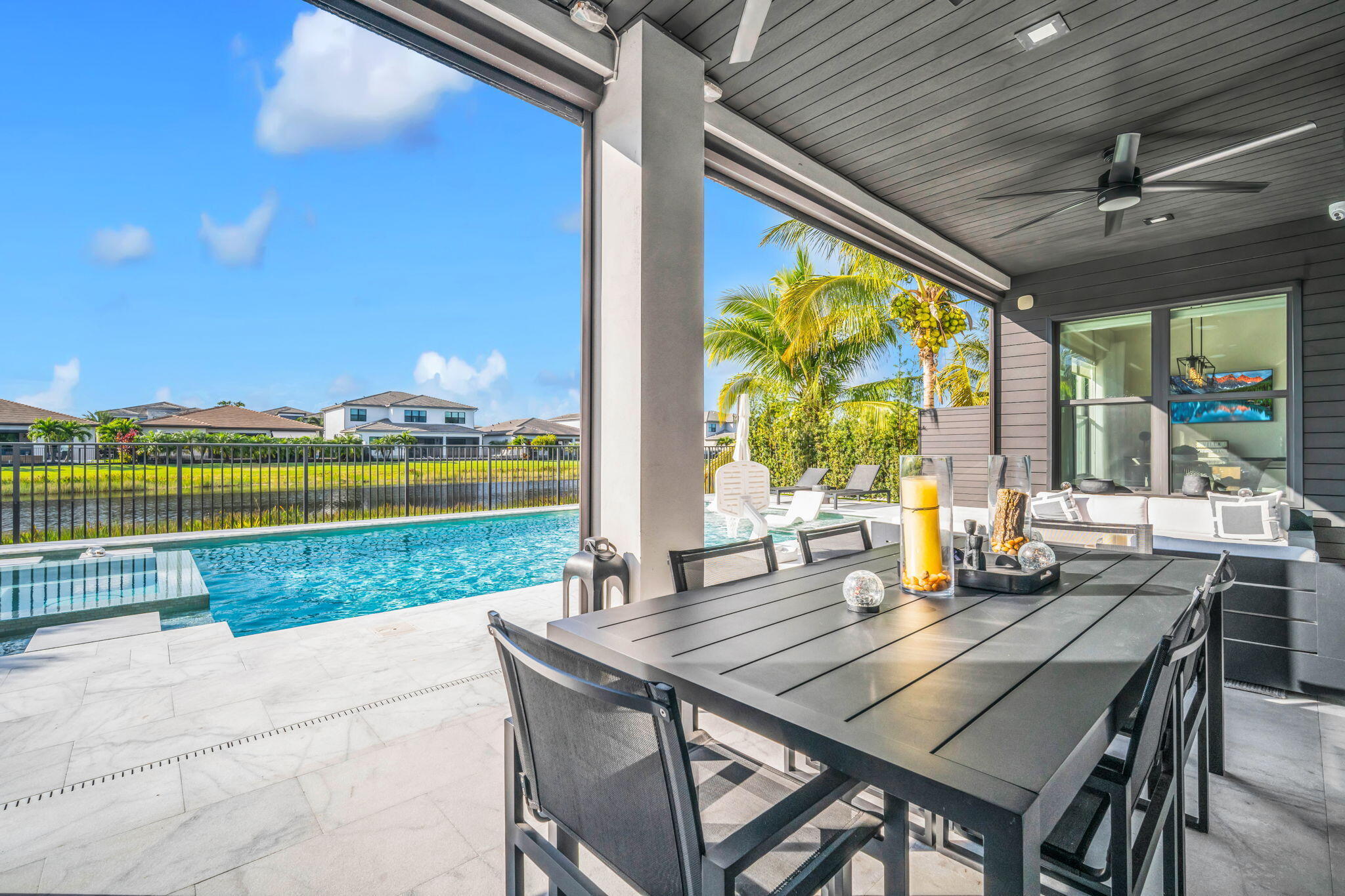 17059 Rainbow Fls Trail Boca Raton, FL 33496 - Photo 54 of 79 a view of a patio with a table and chairs