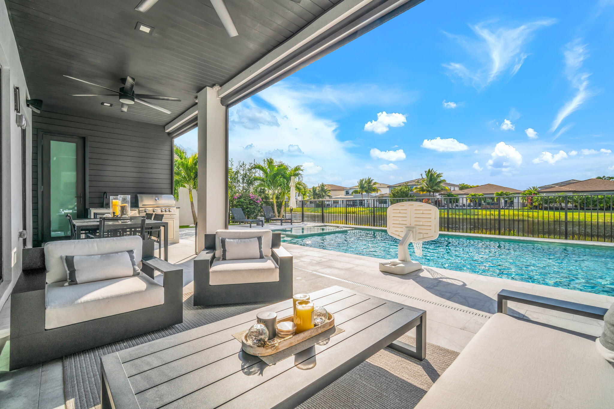 17059 Rainbow Fls Trail Boca Raton, FL 33496 - Photo 56 of 79 a living room with patio furniture and a garden