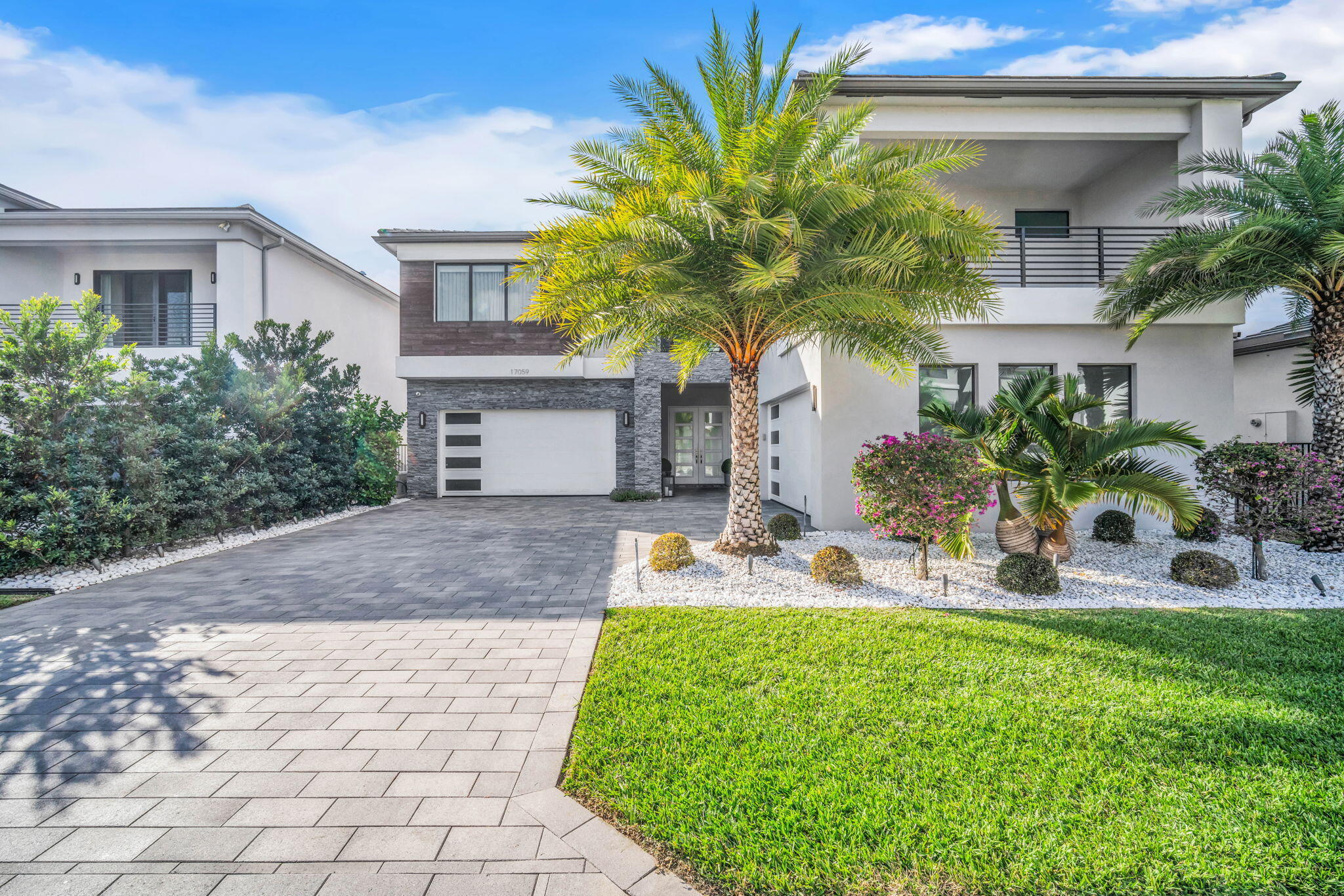 17059 Rainbow Fls Trail Boca Raton, FL 33496 - Photo 69 of 79 a front view of a house with garden and tree