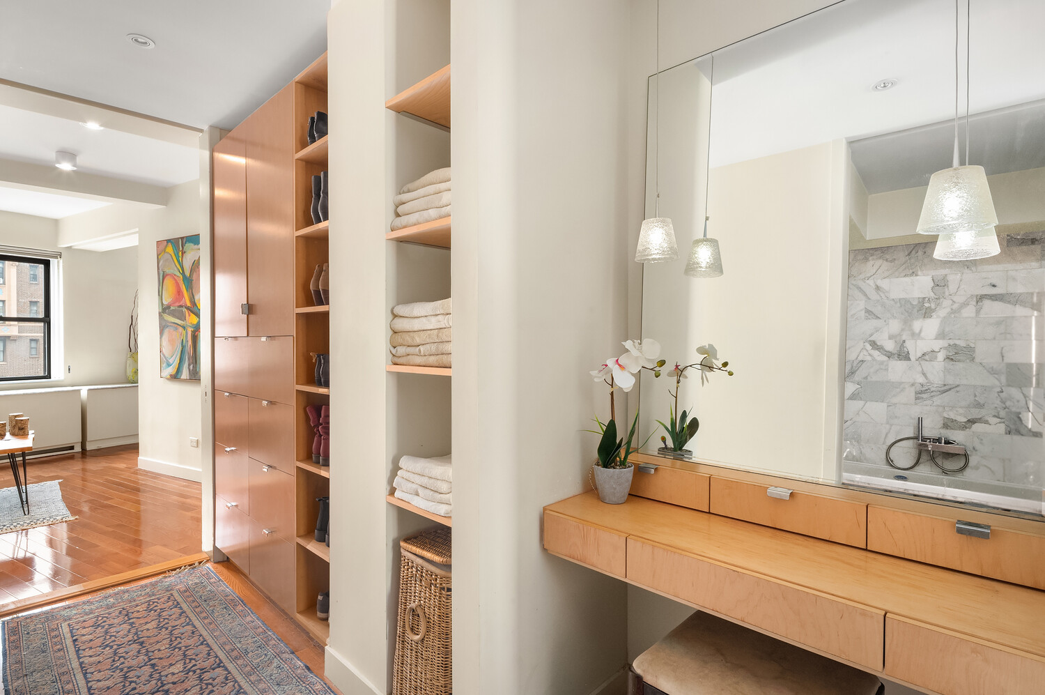 2166 Broadway, Unit 11B Manhattan, NY 10024 - Photo 10 of 14 a bathroom with a sink a mirror and a shower