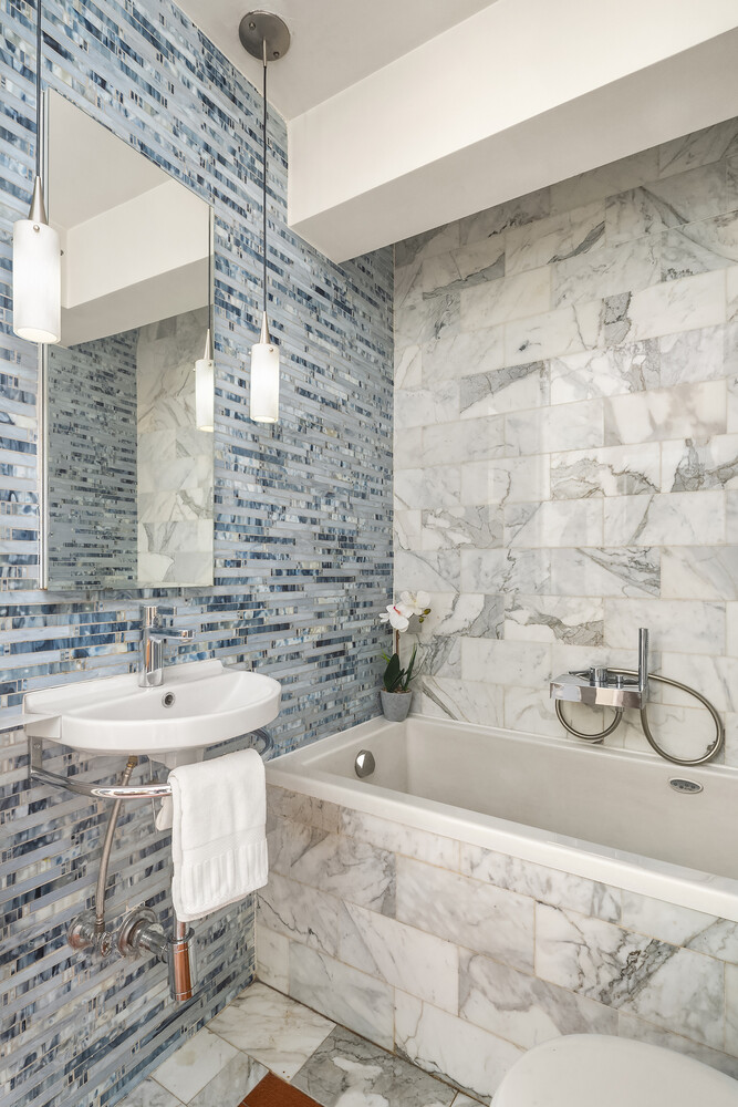 2166 Broadway, Unit 11B Manhattan, NY 10024 - Photo 11 of 14 a bathroom with a sink and a mirror