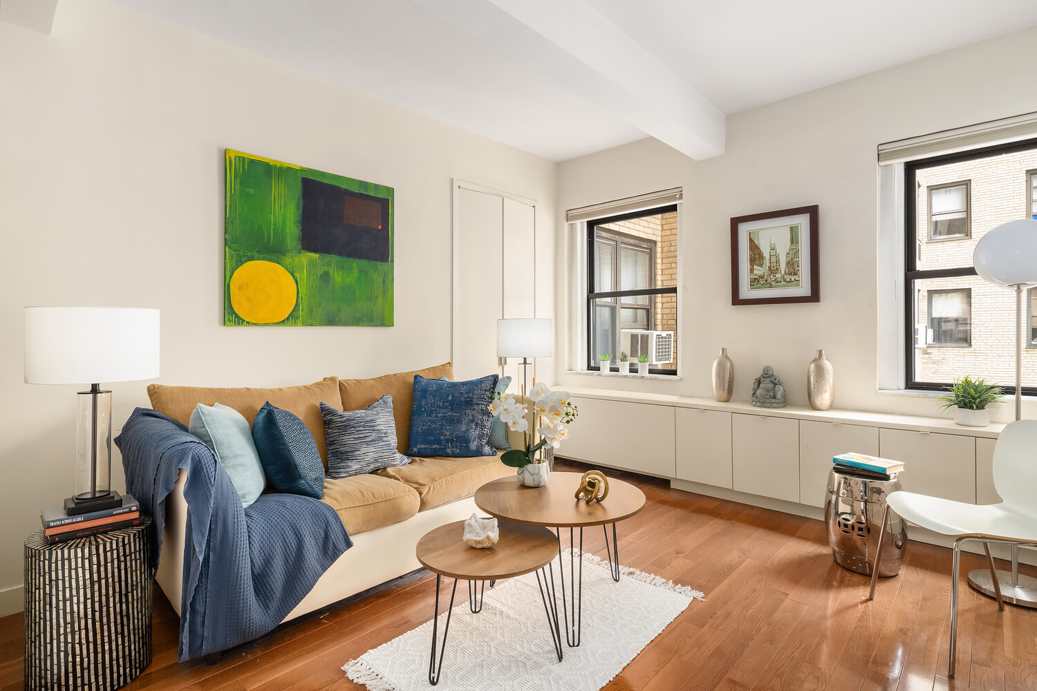 2166 Broadway, Unit 11B Manhattan, NY 10024 - Photo 12 of 14 a living room with furniture and a window