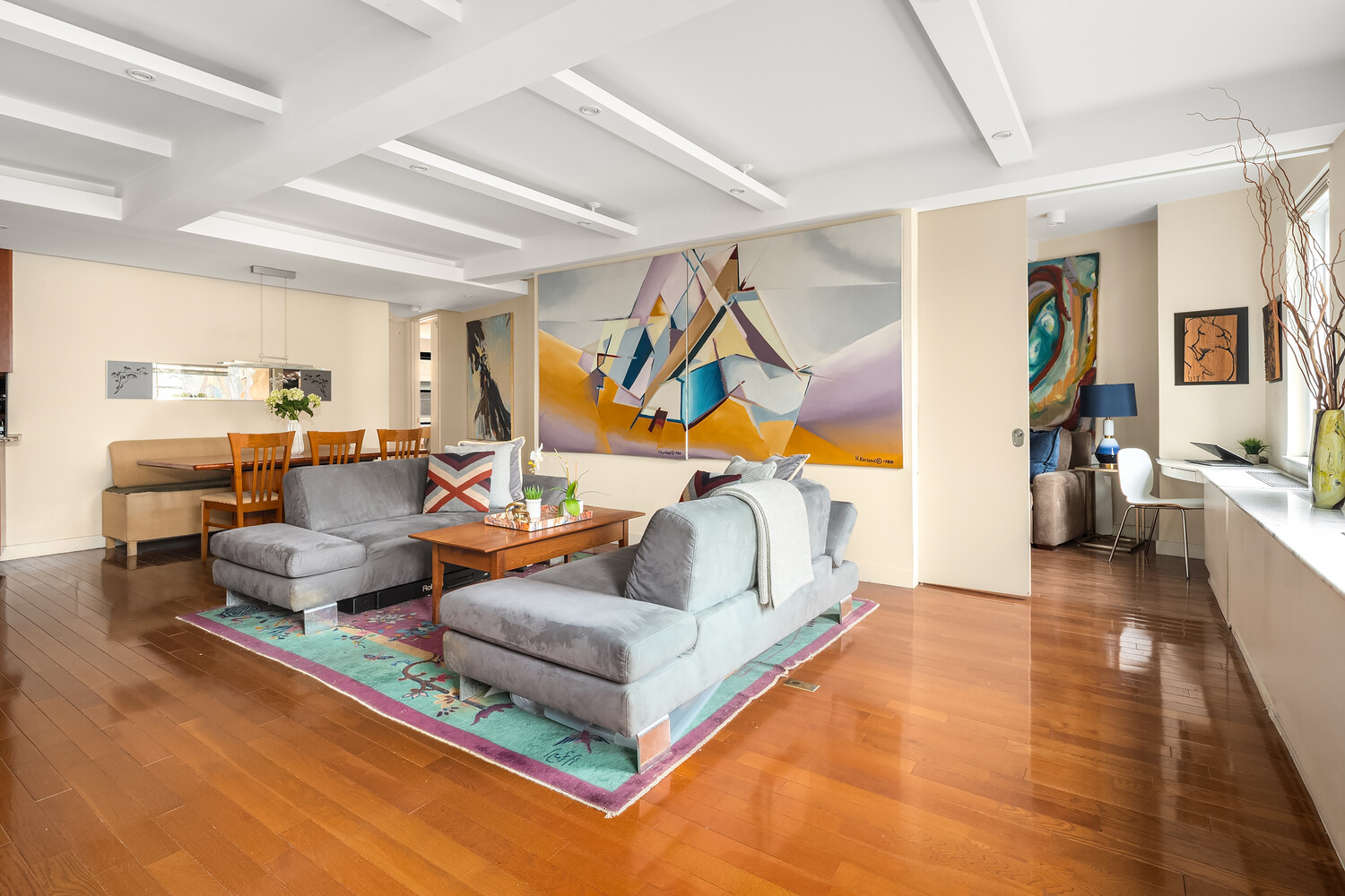 2166 Broadway, Unit 11B Manhattan, NY 10024 - Photo 3 of 14 a living room with furniture and a wooden floor