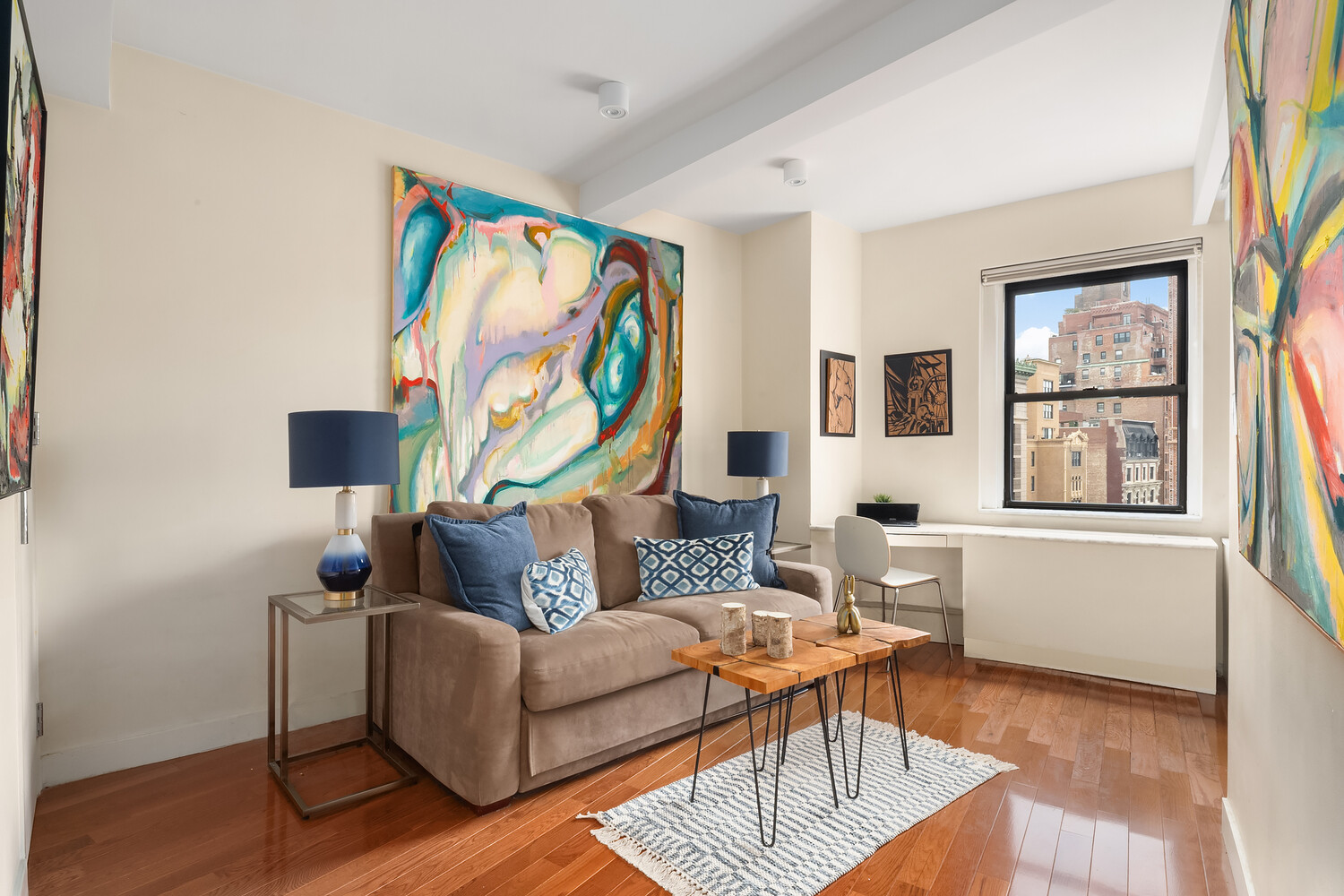 2166 Broadway, Unit 11B Manhattan, NY 10024 - Photo 7 of 14 a living room with furniture and a flat screen tv