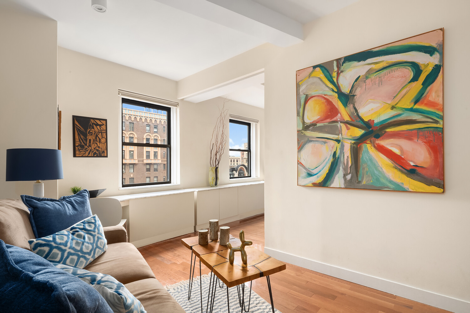 2166 Broadway, Unit 11B Manhattan, NY 10024 - Photo 8 of 14 a living room with furniture and a window