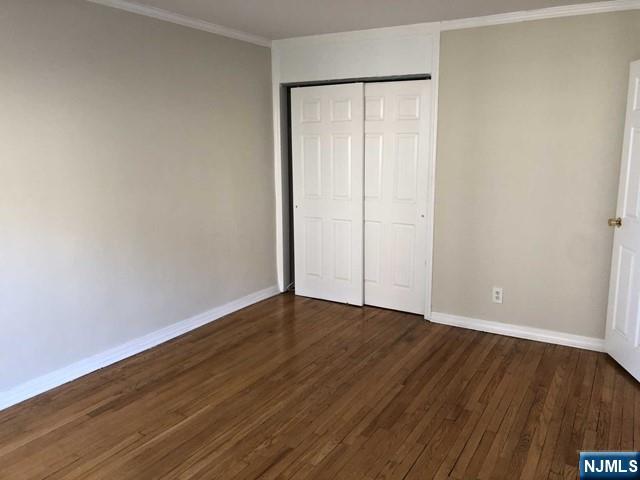 2205 North Central Road, Unit 5A Fort Lee, NJ 07024 - Photo 11 of 24 a view of an empty room with wooden floor