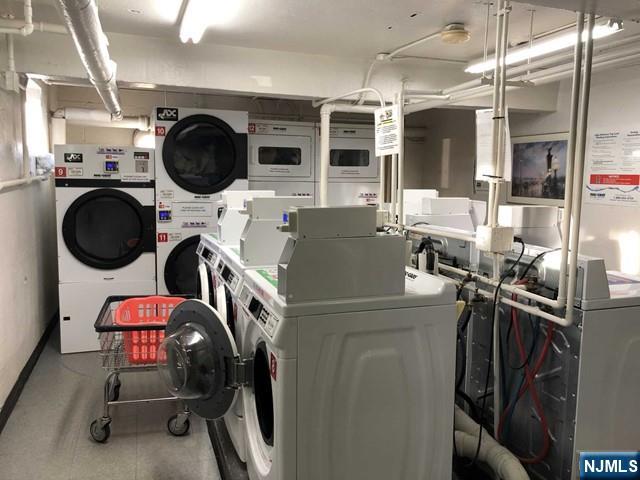 2205 North Central Road, Unit 5A Fort Lee, NJ 07024 - Photo 20 of 24 a view of a kitchen with a stove top oven table and chairs
