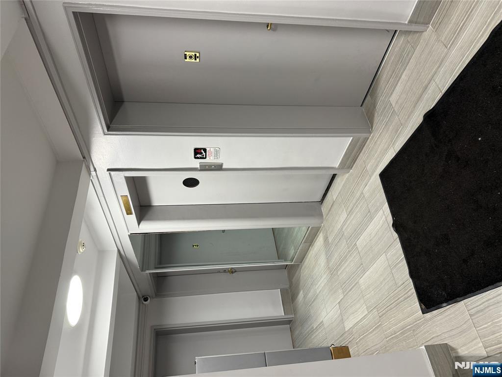 2205 North Central Road, Unit 5A Fort Lee, NJ 07024 - Photo 23 of 24 a view of hallway with shower