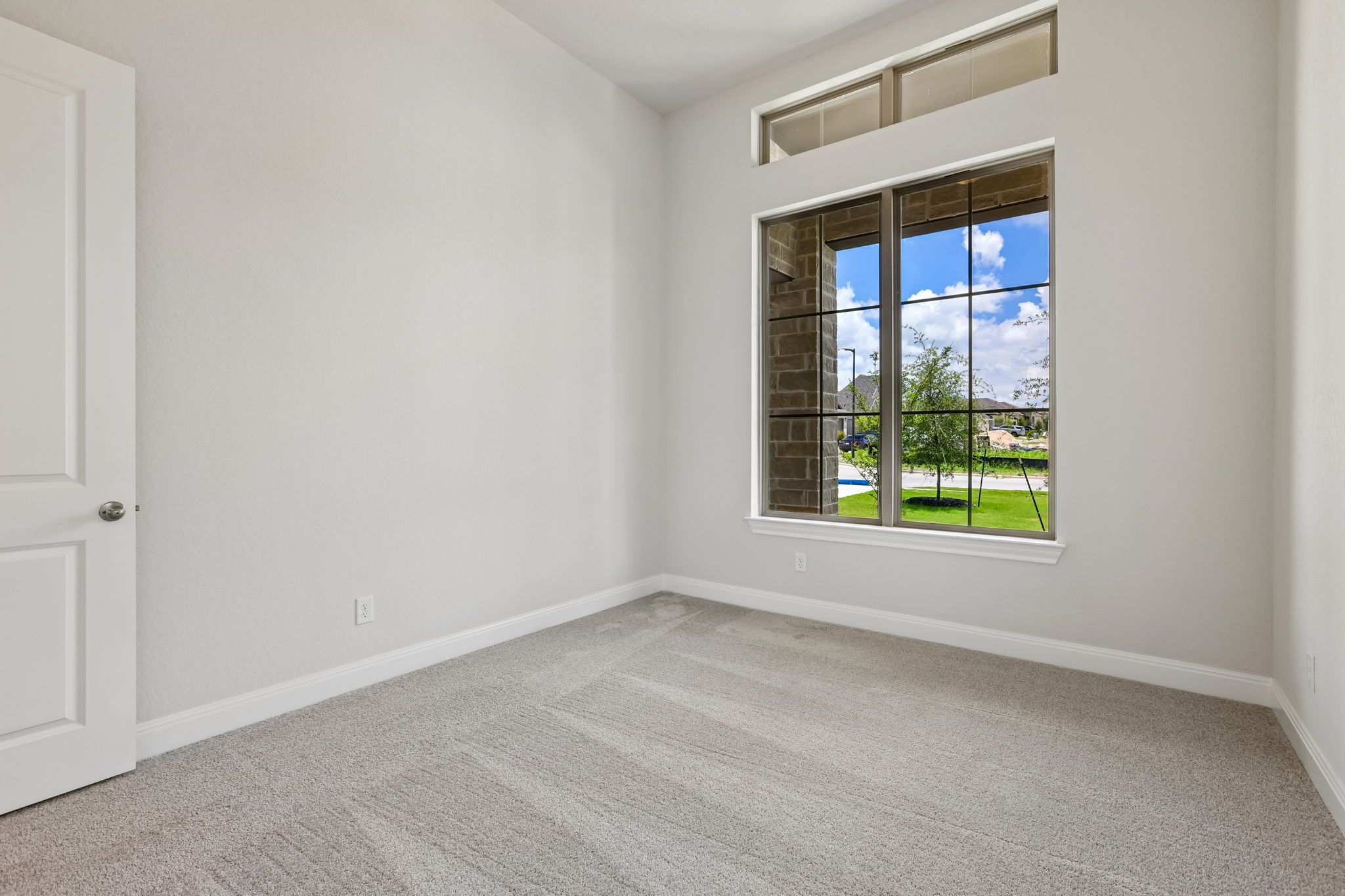 214 Prickly Poppy Loop Kyle, TX 78640 - Photo 17 of 38 a view of an empty room with a window
