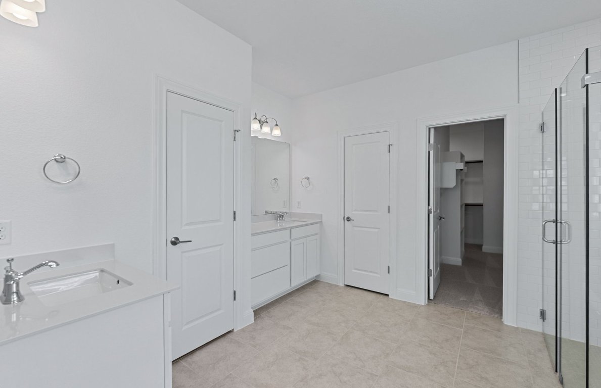 3109 Delaware Street Leander, TX 78641 - Photo 11 of 21 a bathroom with a double vanity sink a and mirror