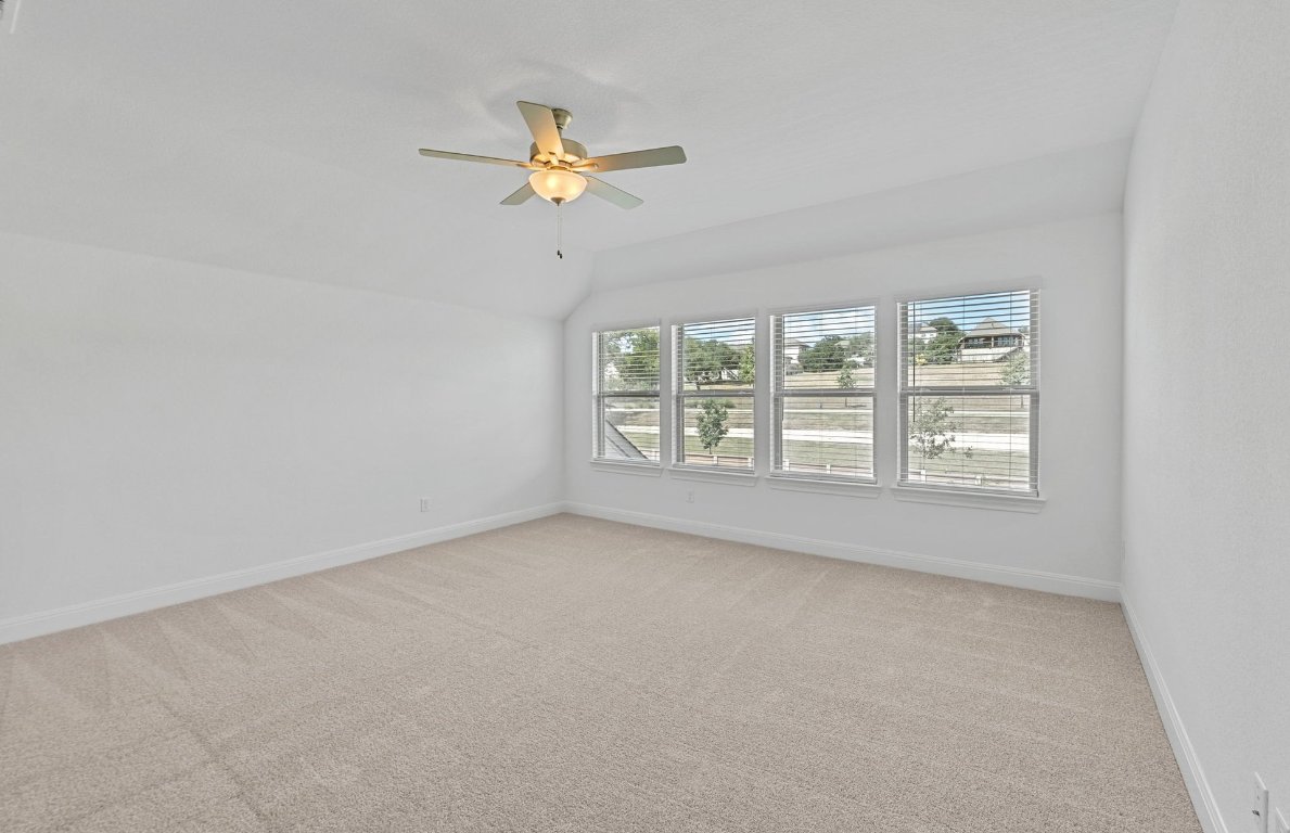 3109 Delaware Street Leander, TX 78641 - Photo 13 of 21 an empty room with windows and fan