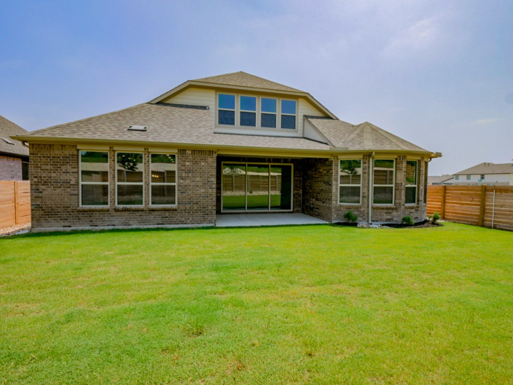 3109 Delaware Street Leander, TX 78641 - Photo 17 of 21 a front view of a house with a garden