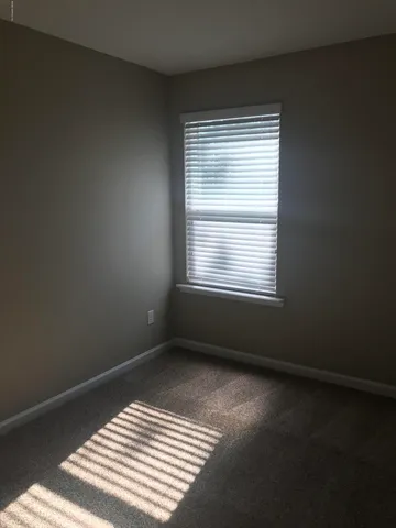 a view of a room with a window