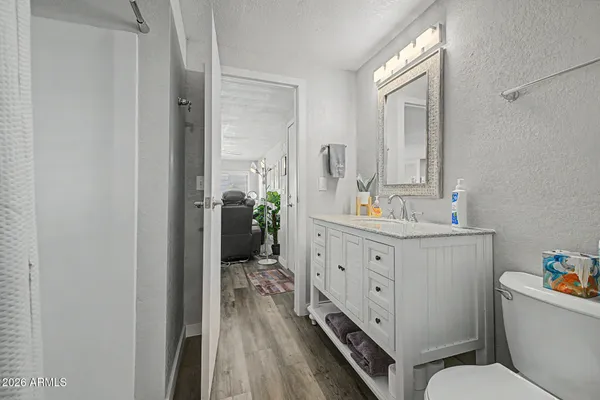 a bathroom with a double vanity sink and mirror