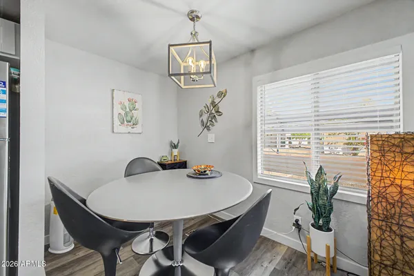 a view of a dining room with furniture window and wooden floor
