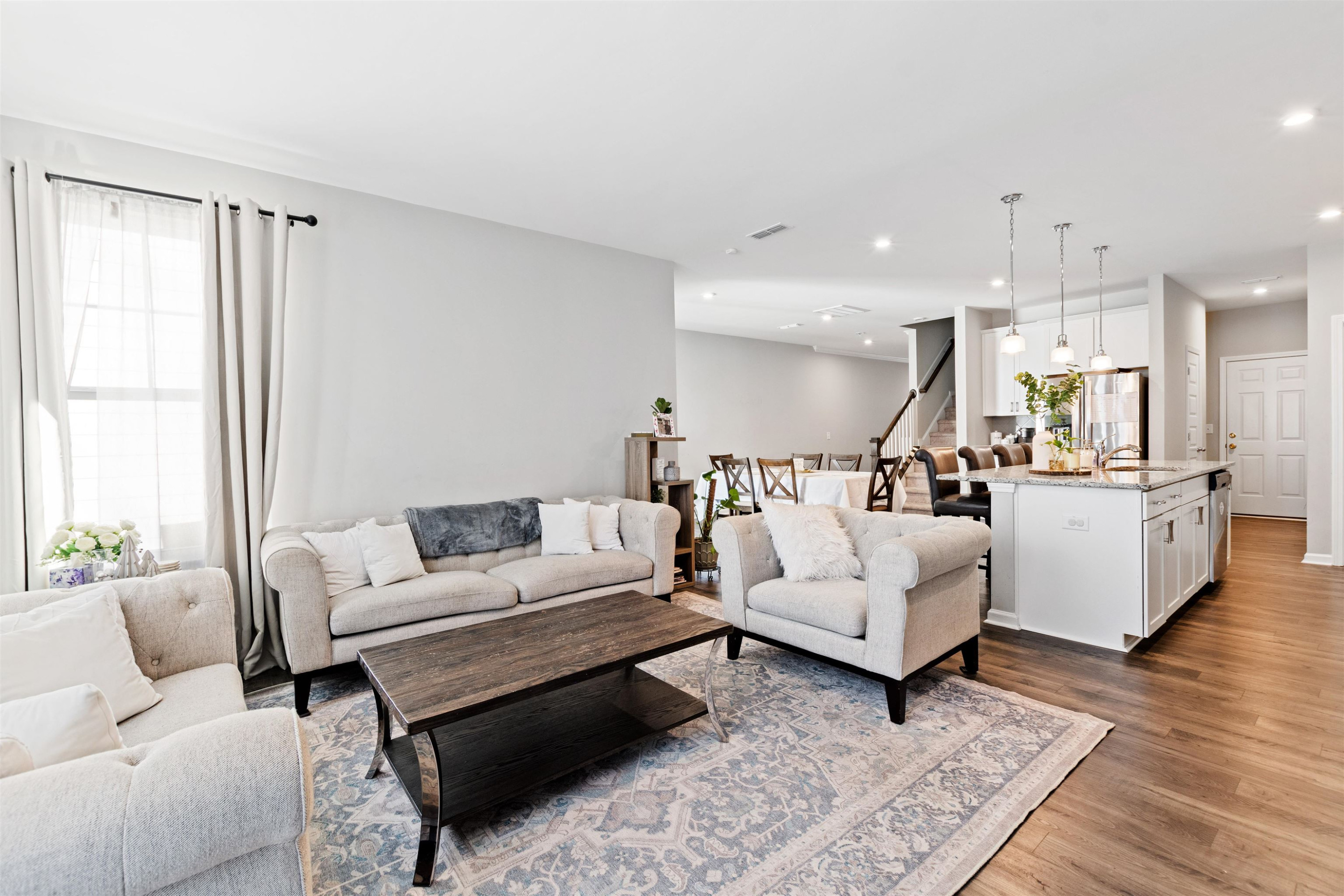 1636 Brussels Drive Apex, NC 27502 - Photo 14 of 35 a living room with furniture and wooden floor