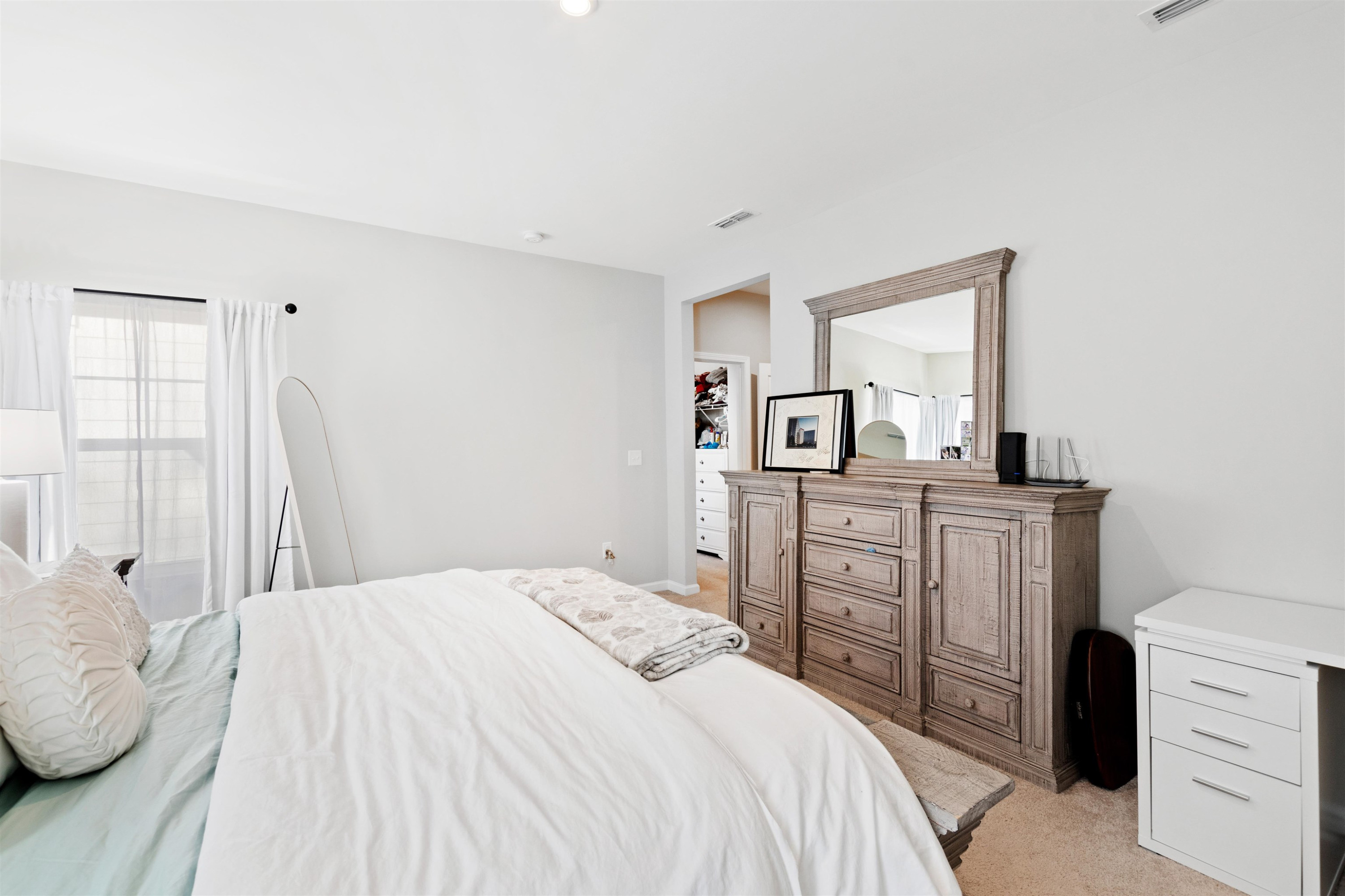 1636 Brussels Drive Apex, NC 27502 - Photo 20 of 35 a bedroom with a bed and dresser