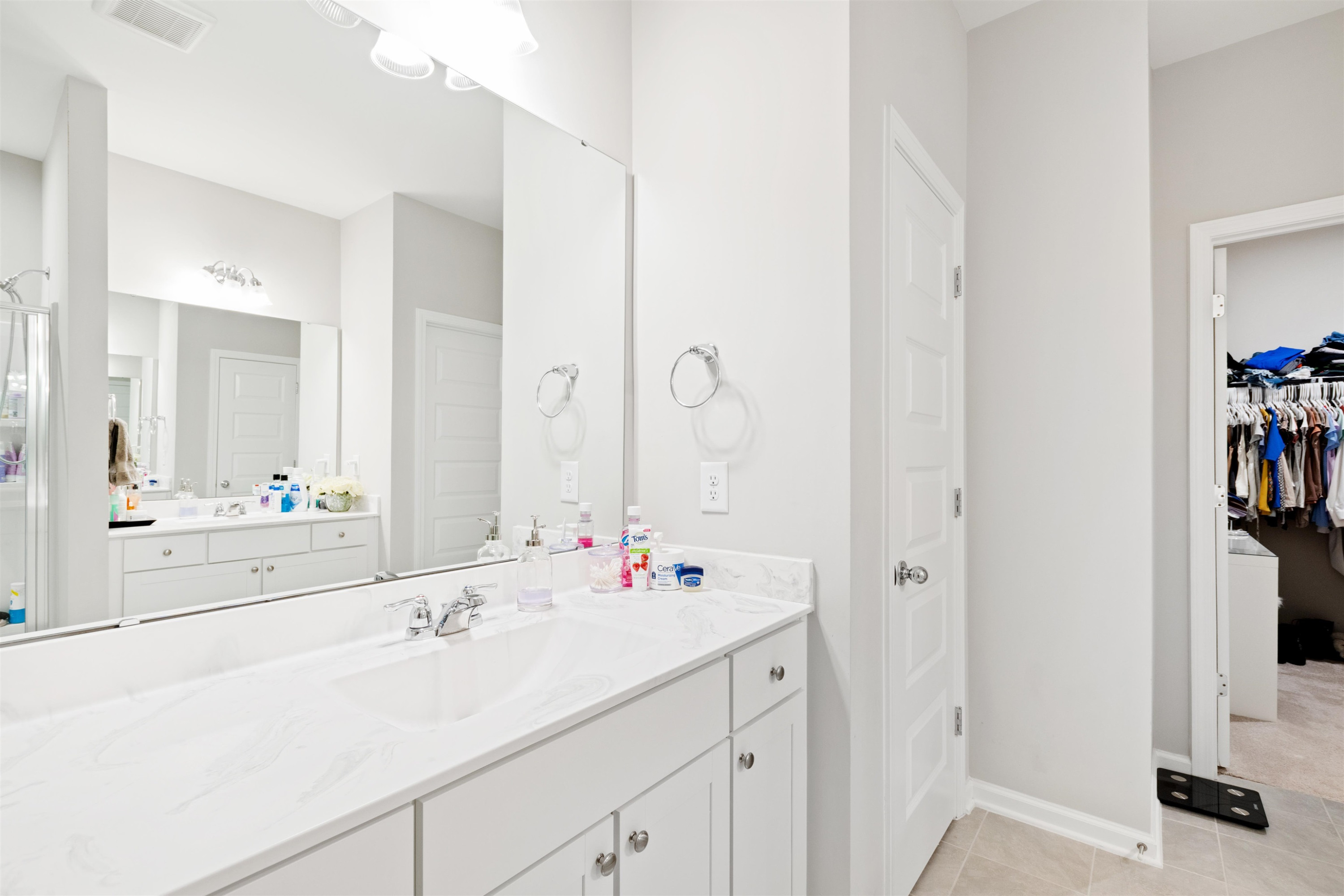 1636 Brussels Drive Apex, NC 27502 - Photo 23 of 35 a bathroom with a sink and a mirror