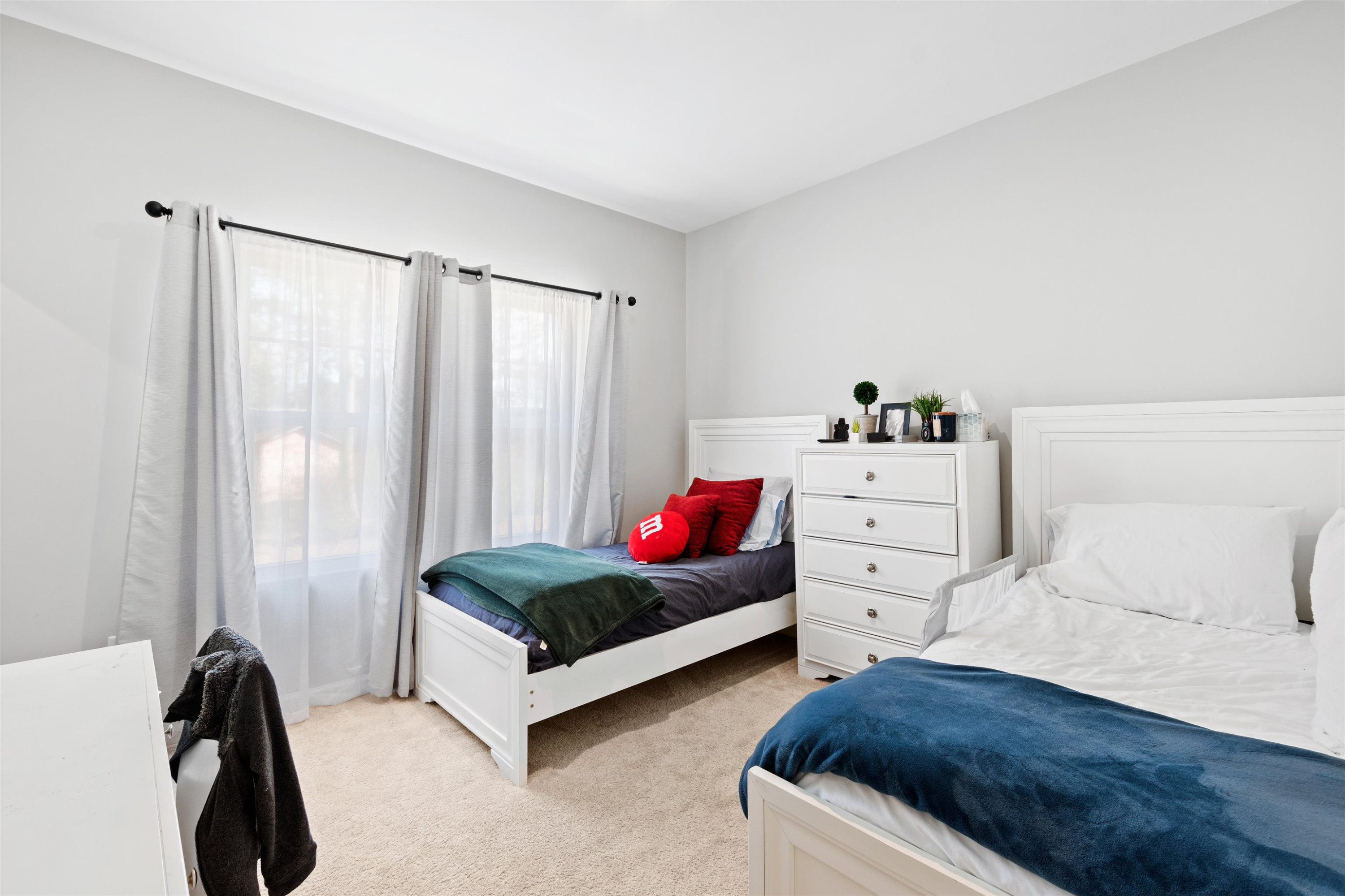 1636 Brussels Drive Apex, NC 27502 - Photo 24 of 35 a bedroom with a bed and a window