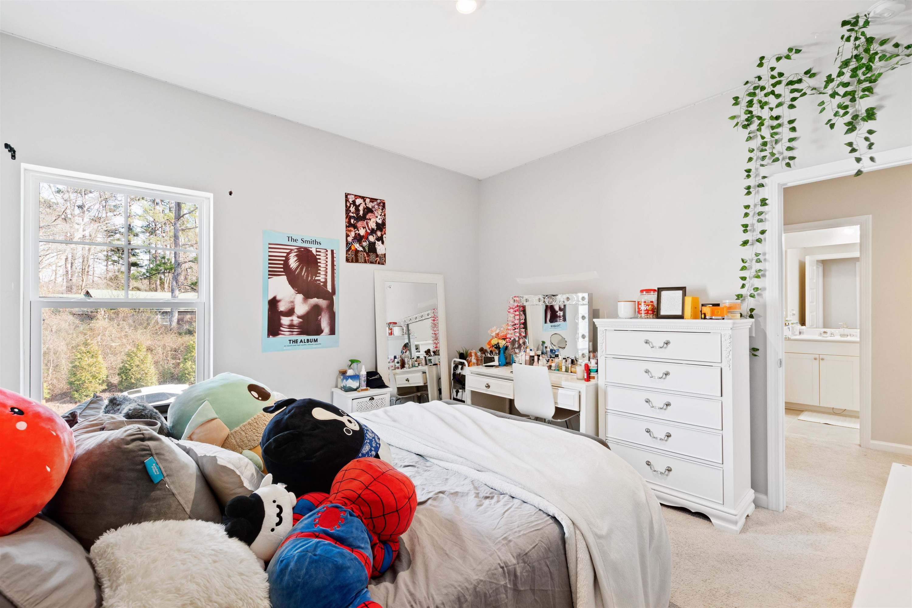 1636 Brussels Drive Apex, NC 27502 - Photo 26 of 35 a bedroom with a bed and a window