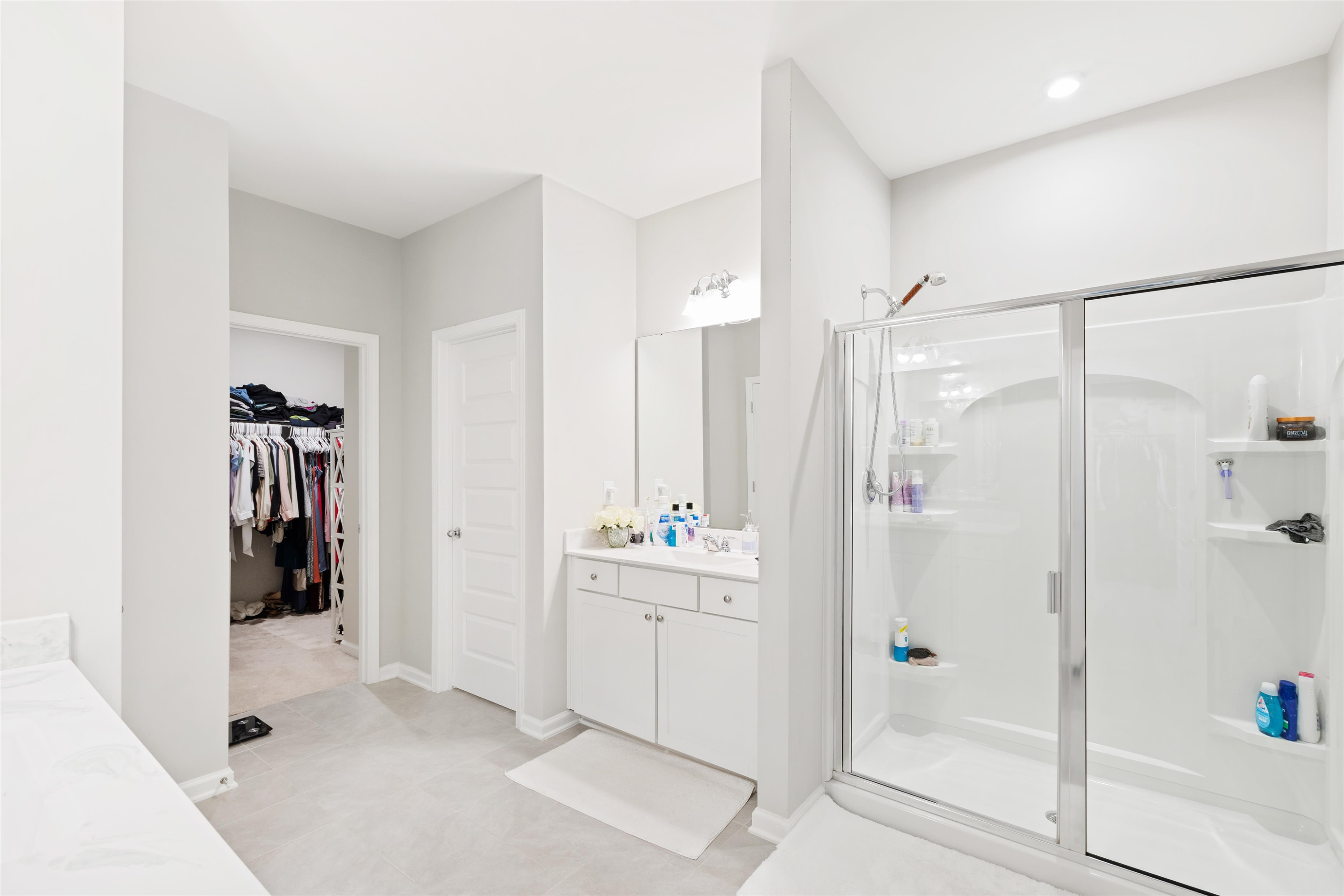 1636 Brussels Drive Apex, NC 27502 - Photo 28 of 35 a bathroom with a shower and a sink