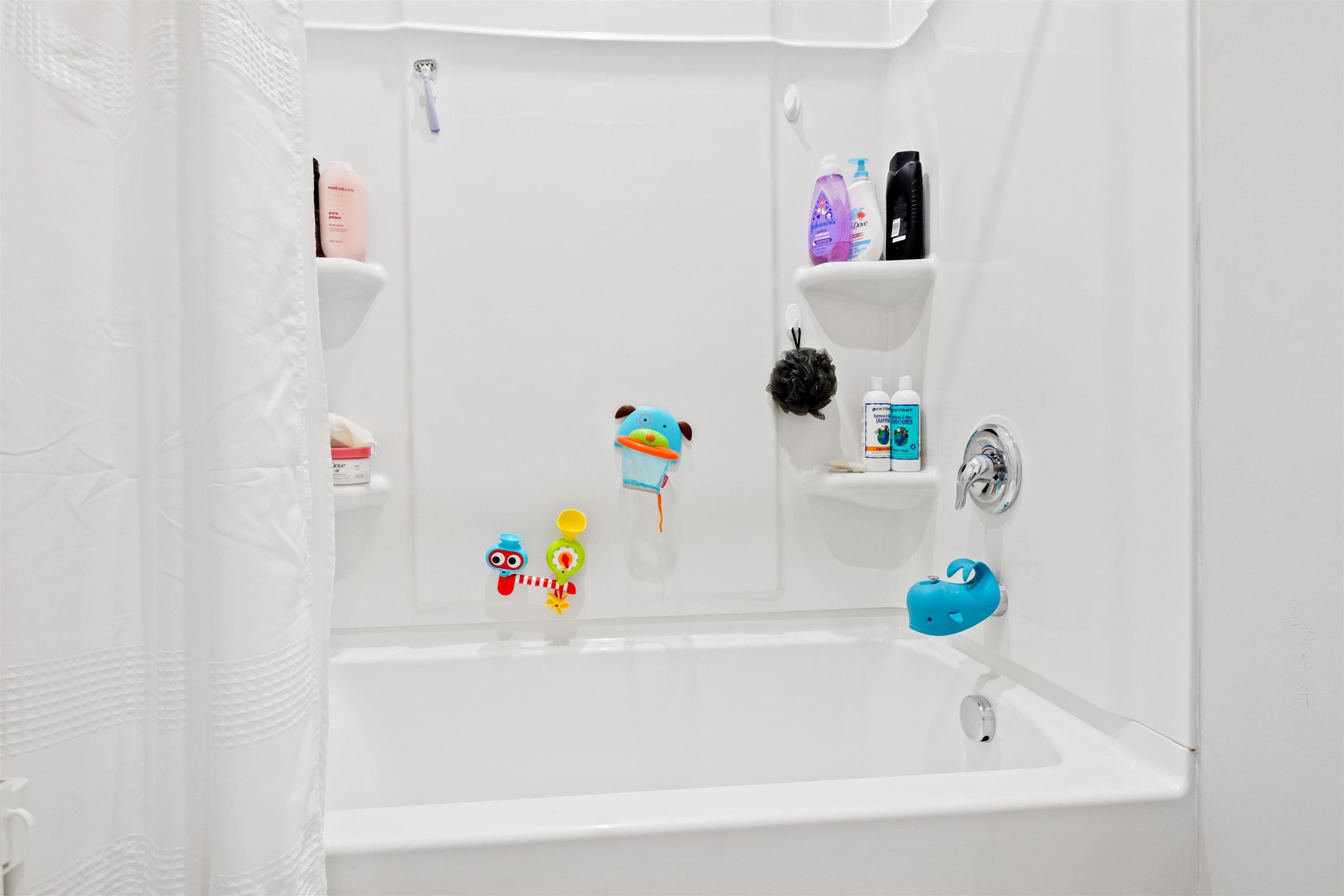 1636 Brussels Drive Apex, NC 27502 - Photo 29 of 35 a bathroom with a white bath tub