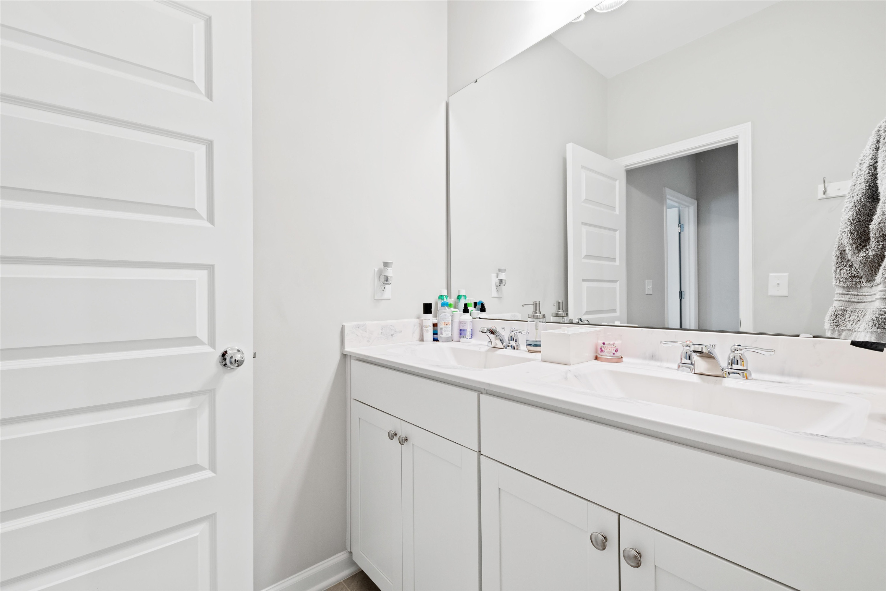 1636 Brussels Drive Apex, NC 27502 - Photo 30 of 35 a bathroom with a double vanity sink and mirror