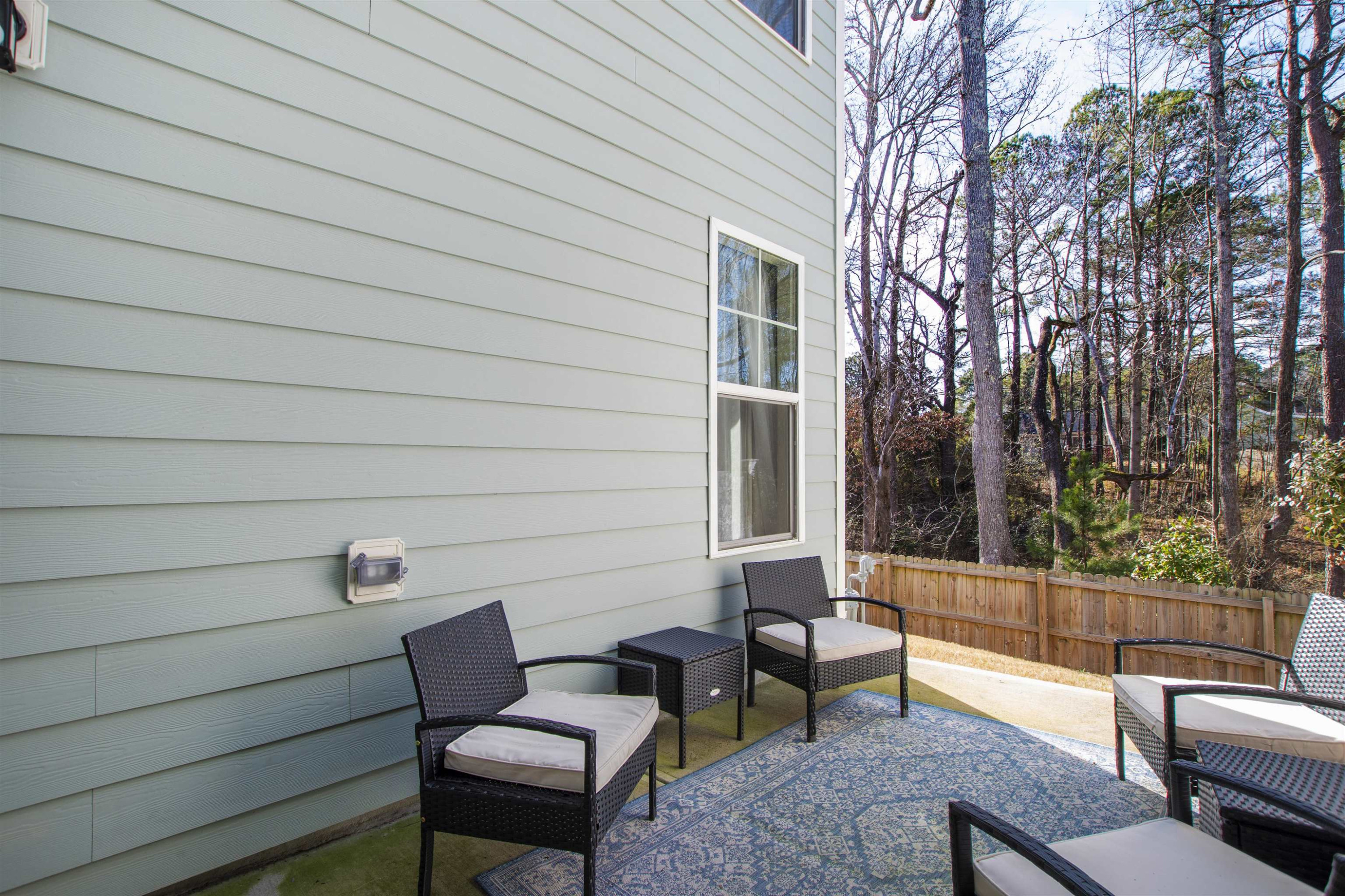 1636 Brussels Drive Apex, NC 27502 - Photo 35 of 35 a view of a patio with couches chairs and a fire pit
