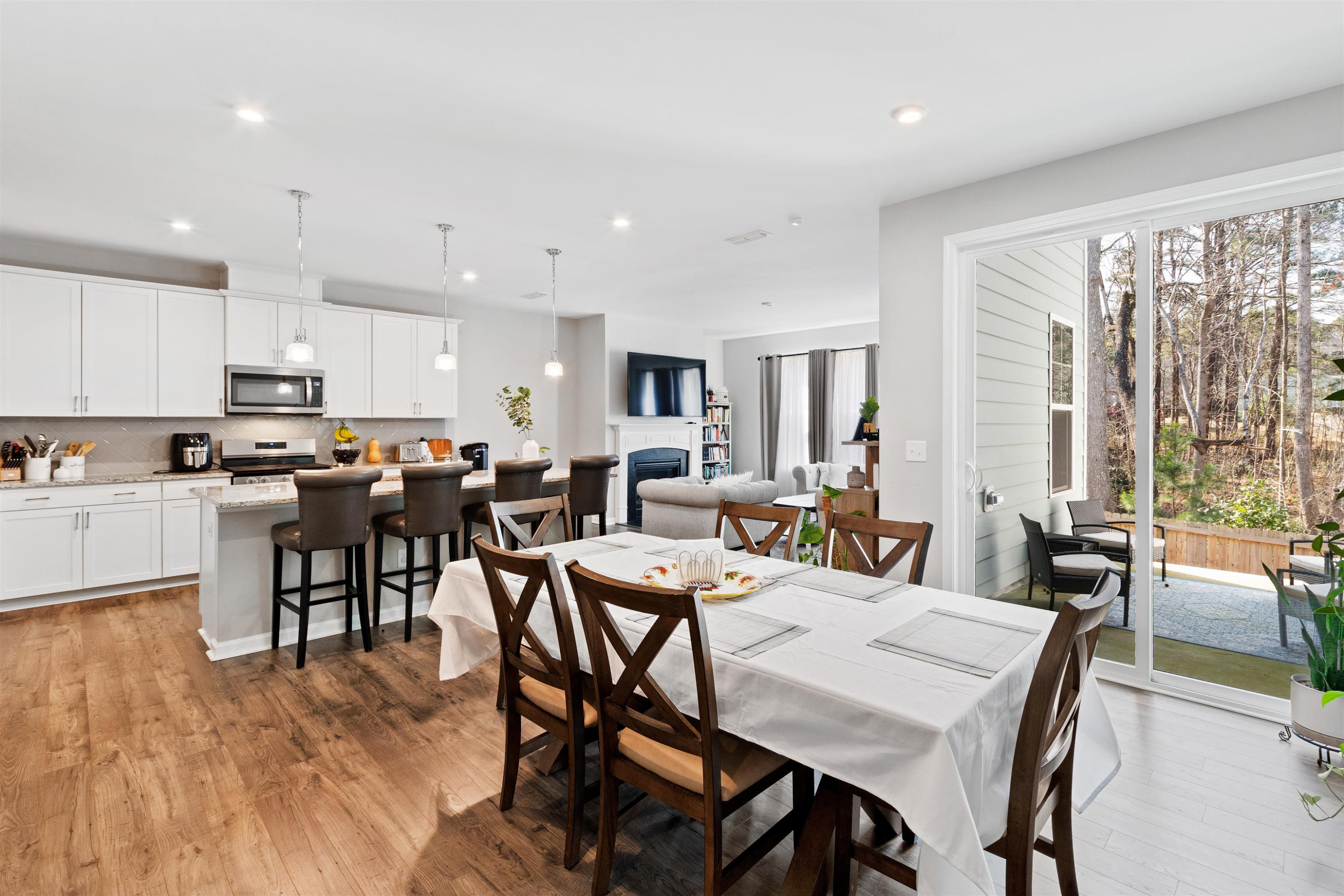 1636 Brussels Drive Apex, NC 27502 - Photo 4 of 35 a large kitchen with a table and chairs