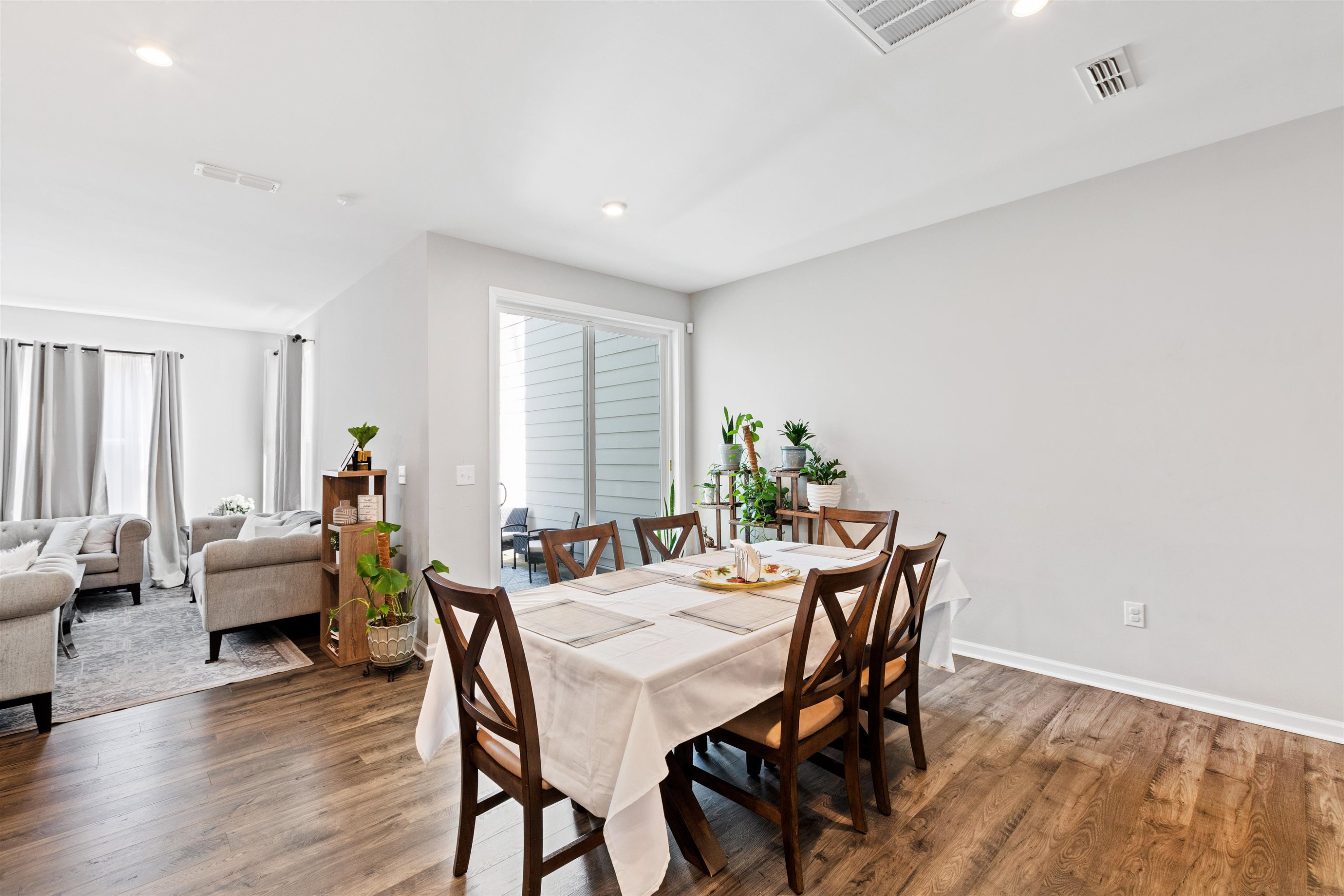 1636 Brussels Drive Apex, NC 27502 - Photo 5 of 35 a dining room with furniture and wooden floor