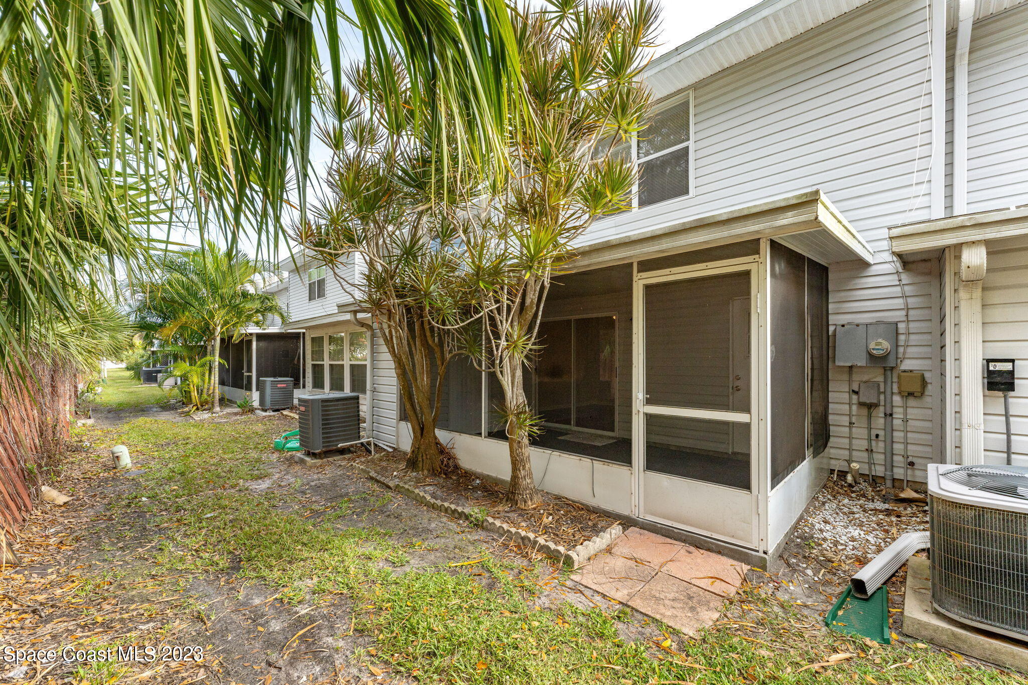 2717 Manor Drive Northeast Palm Bay, FL 32905 - Photo 13 of 21 a view of a house with a yard