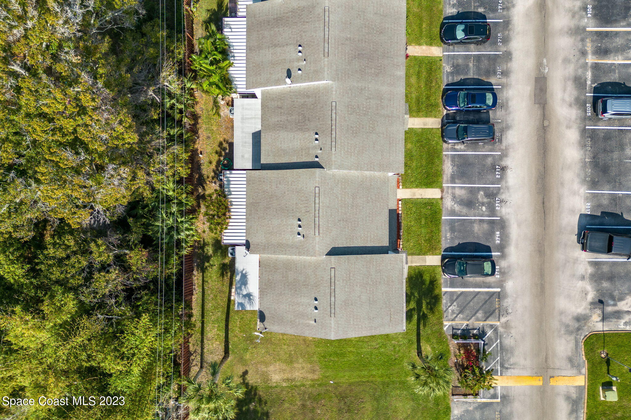 2717 Manor Drive Northeast Palm Bay, FL 32905 - Photo 18 of 21 aerial view of a house with a yard