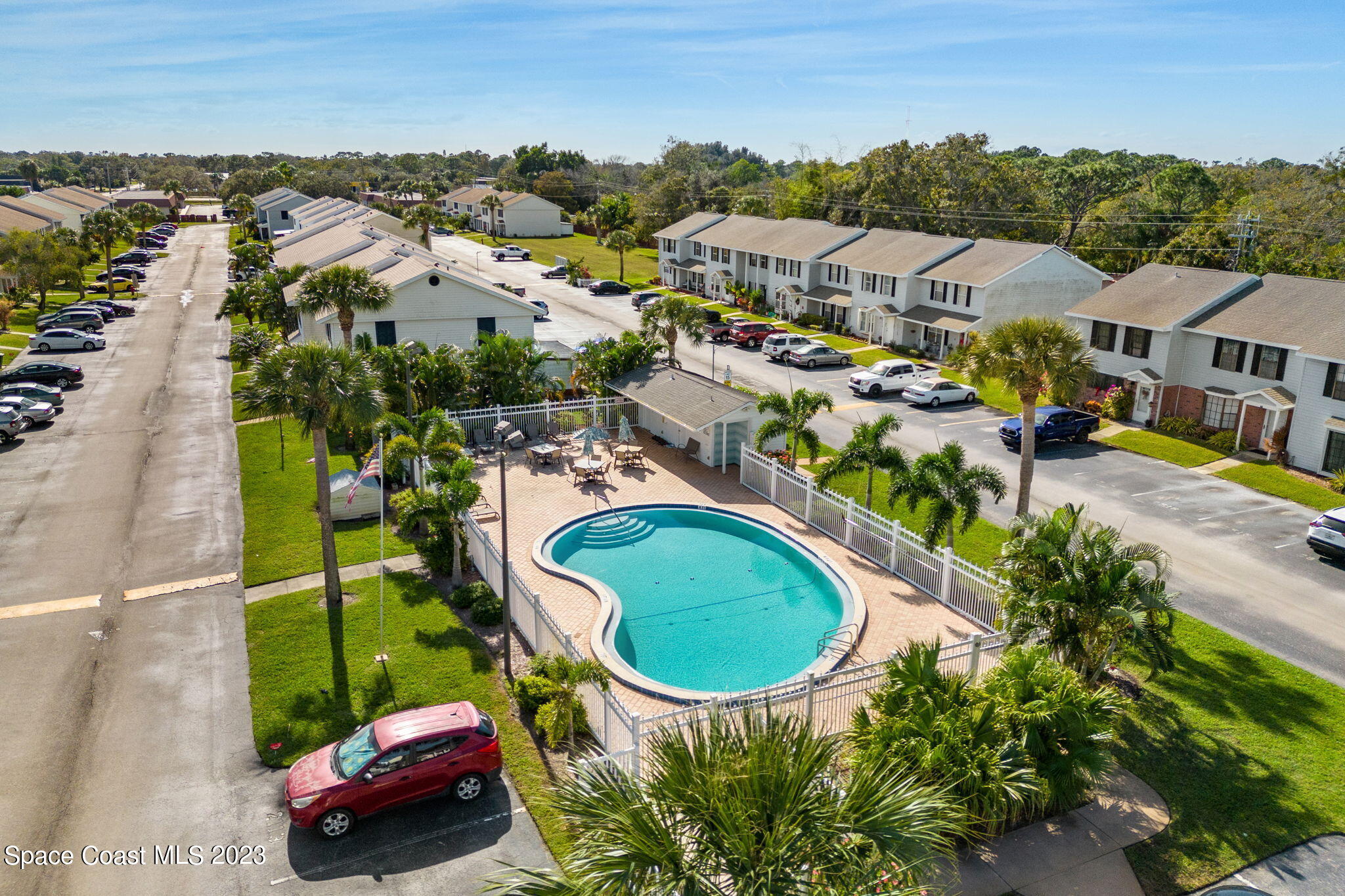 2717 Manor Drive Northeast Palm Bay, FL 32905 - Photo 20 of 21 an aerial view of residential houses with outdoor space and swimming pool