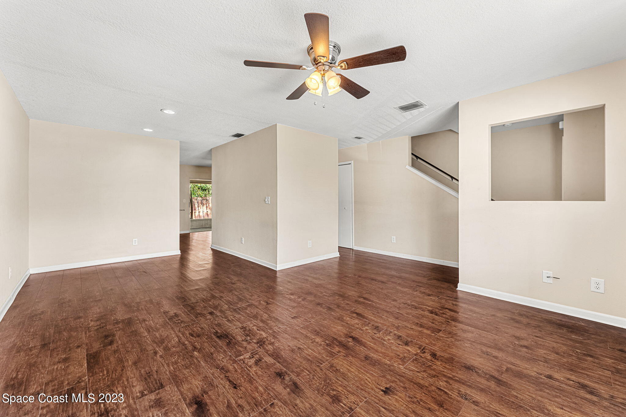 2717 Manor Drive Northeast Palm Bay, FL 32905 - Photo 3 of 21 a view of an empty room with wooden floor