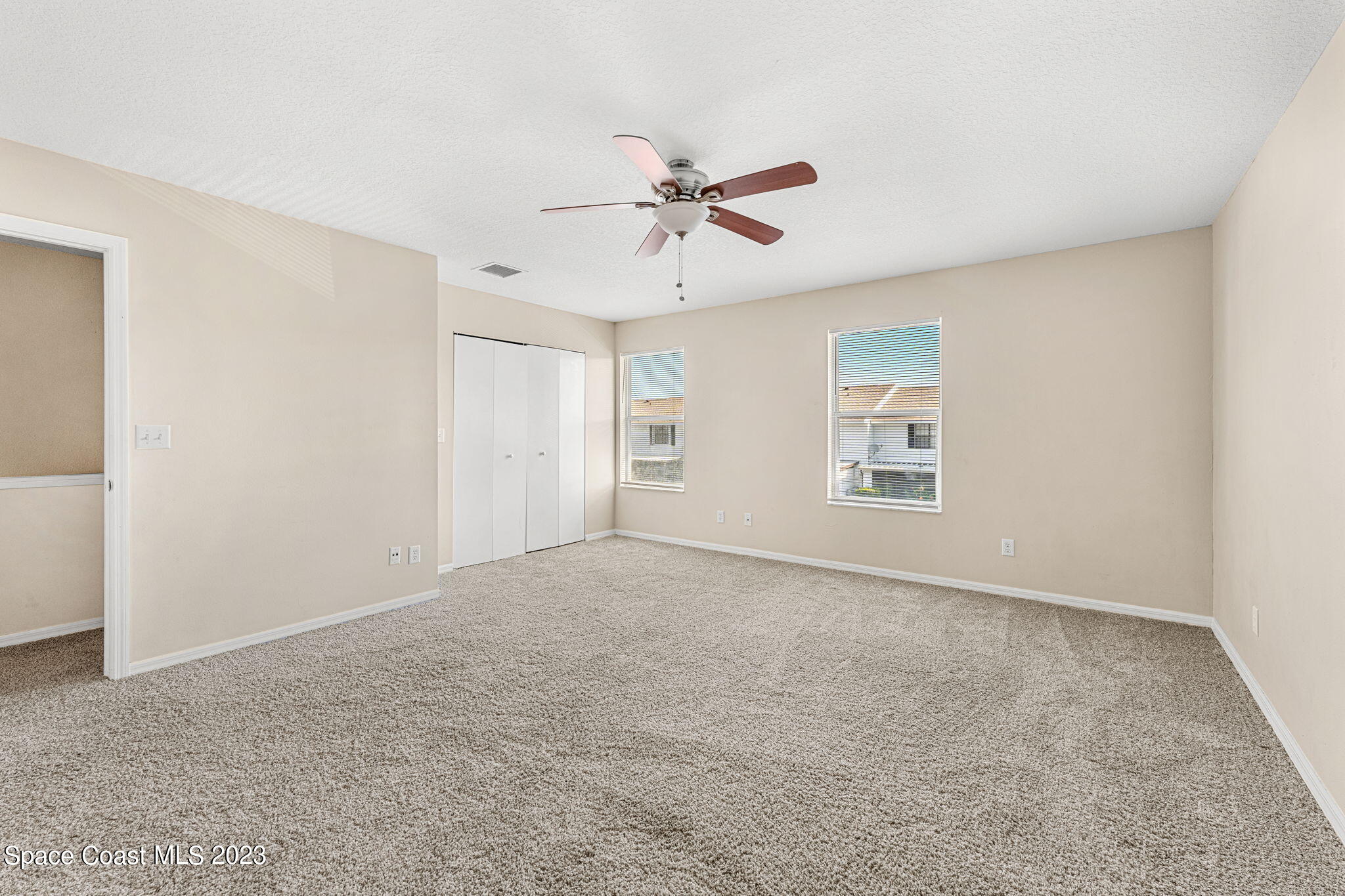 2717 Manor Drive Northeast Palm Bay, FL 32905 - Photo 7 of 21 a view of an empty room with a window