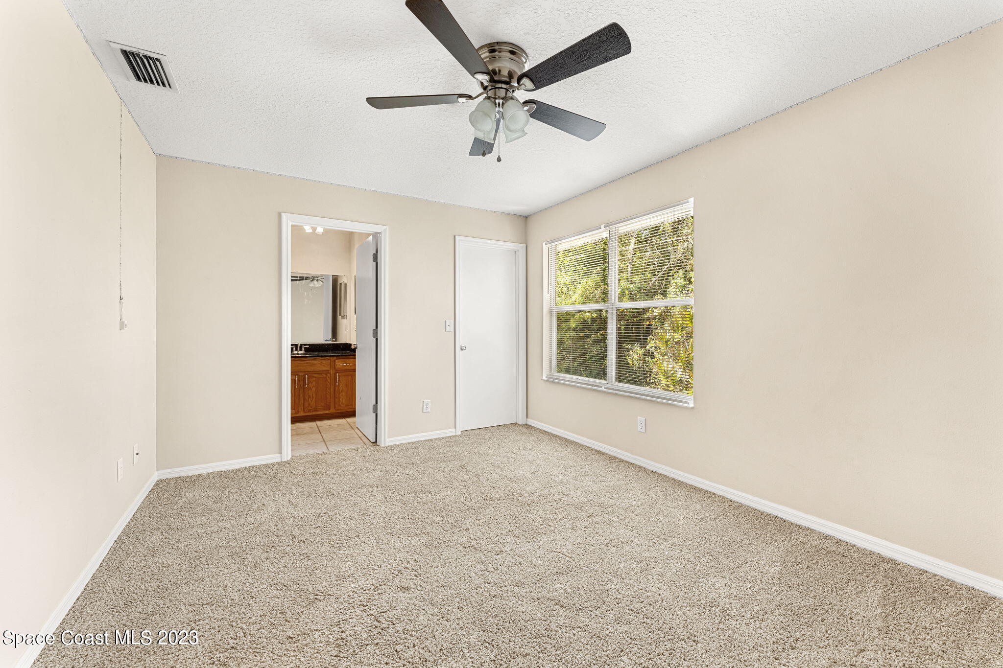 2717 Manor Drive Northeast Palm Bay, FL 32905 - Photo 10 of 21 a view of an empty room with a window