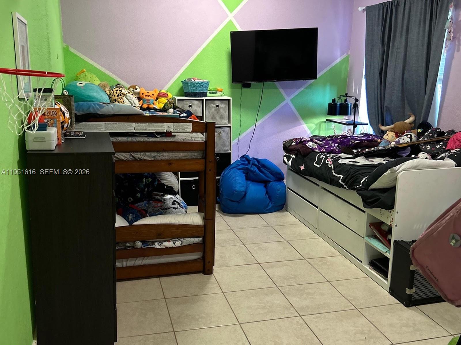 1537 Northwest 64th Street Miami, FL 33147 - Photo 4 of 7 a kitchen with stainless steel appliances kitchen island granite countertop a sink and a stove top oven