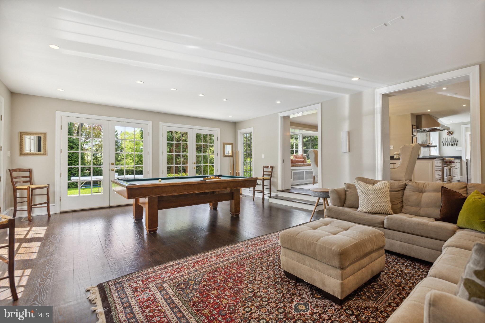 675 Church Road Wayne, PA 19087 - Photo 27 of 57 Family Room - French Doors open to Terrace & Lawn