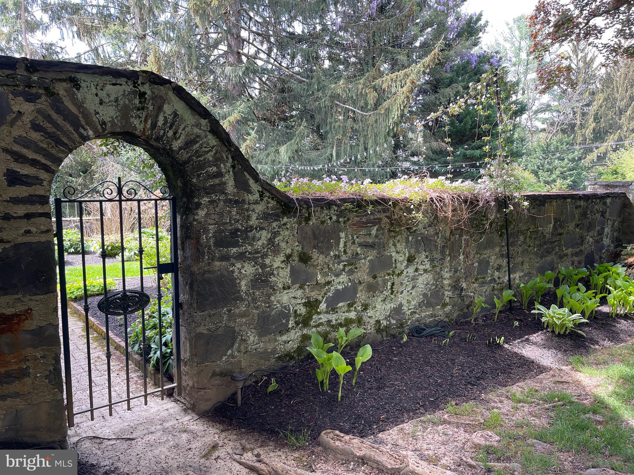 675 Church Road Wayne, PA 19087 - Photo 51 of 57 Gated Entry from Driveway into Walled Garden Room