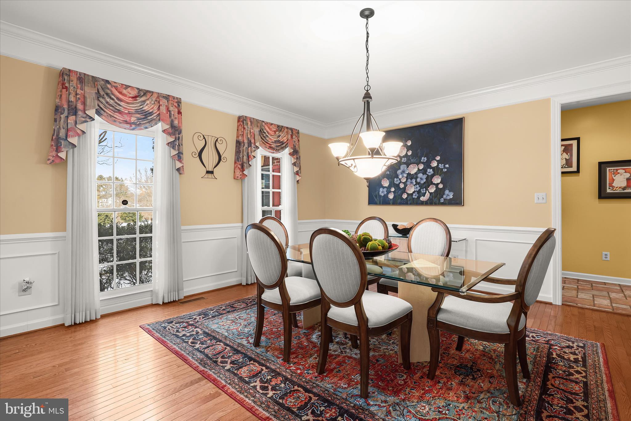 8061 Hunterbrooke Lane Fulton, MD 20759 - Photo 12 of 90 a dining room with furniture a chandelier and wooden floor