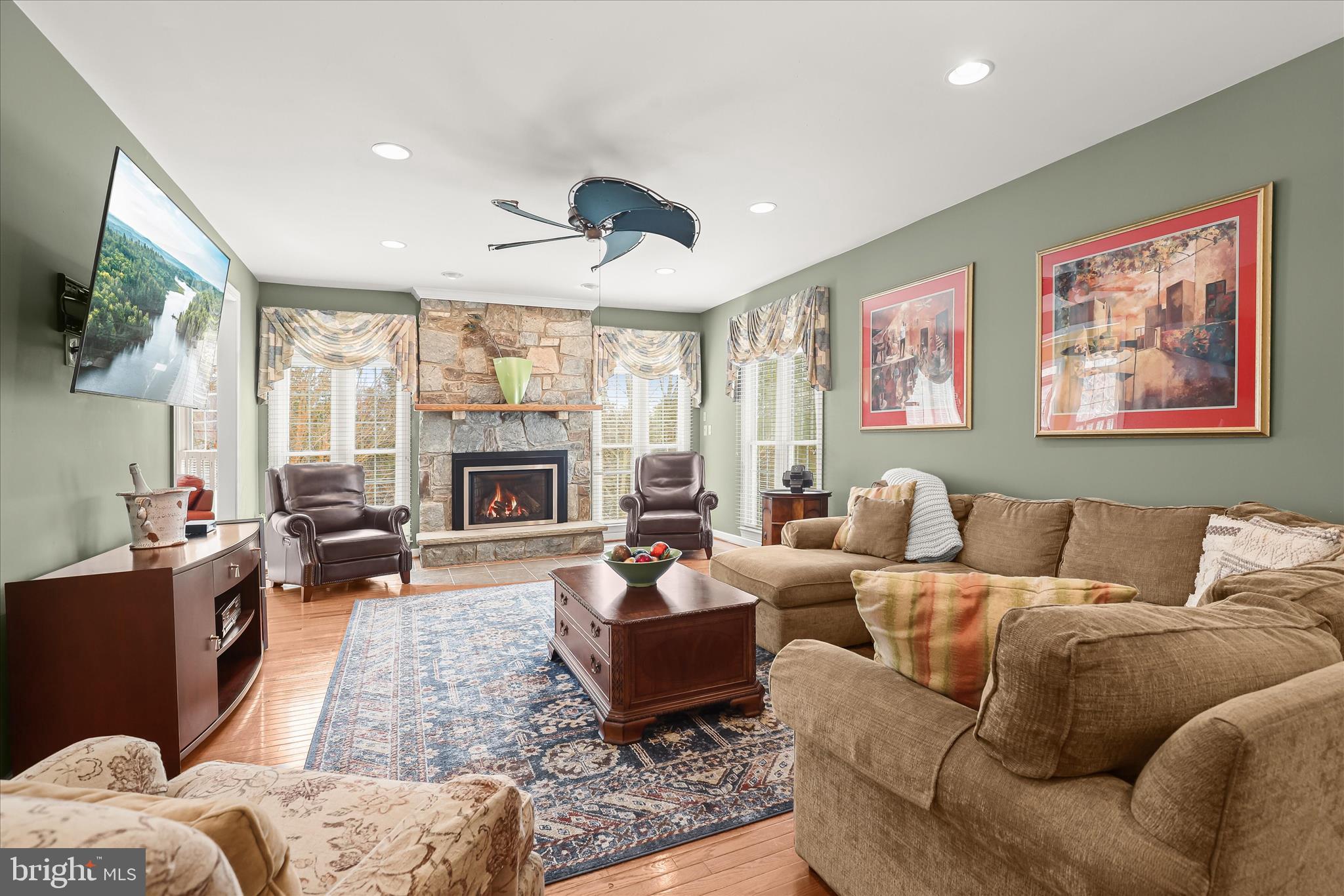 8061 Hunterbrooke Lane Fulton, MD 20759 - Photo 14 of 90 a living room with furniture fireplace and flat screen tv