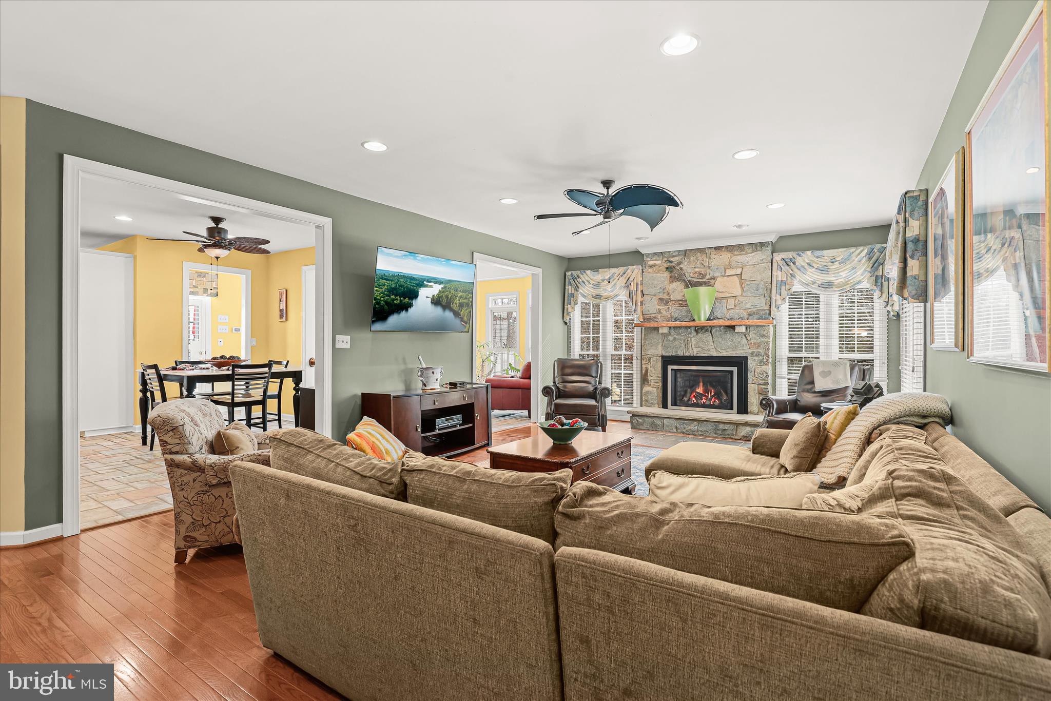 8061 Hunterbrooke Lane Fulton, MD 20759 - Photo 15 of 90 a living room with furniture and a fireplace