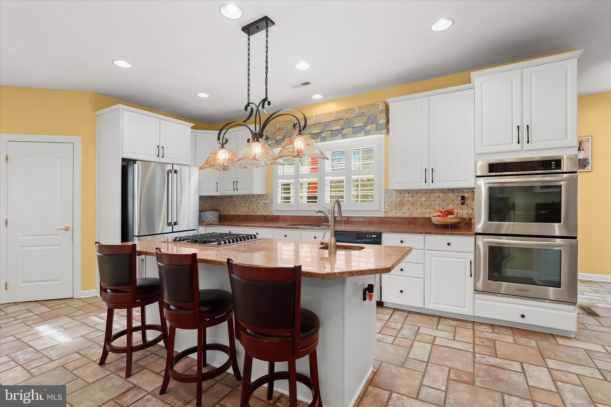 8061 Hunterbrooke Lane Fulton, MD 20759 - Photo 20 of 90 a kitchen with a sink a stove a refrigerator and white cabinets