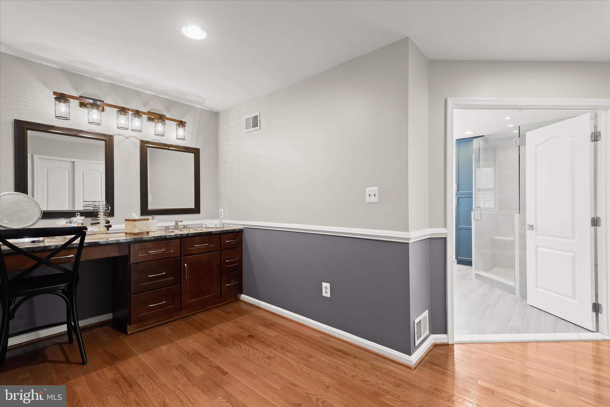 8061 Hunterbrooke Lane Fulton, MD 20759 - Photo 37 of 77 a spacious bathroom with a granite countertop sink and a mirror
