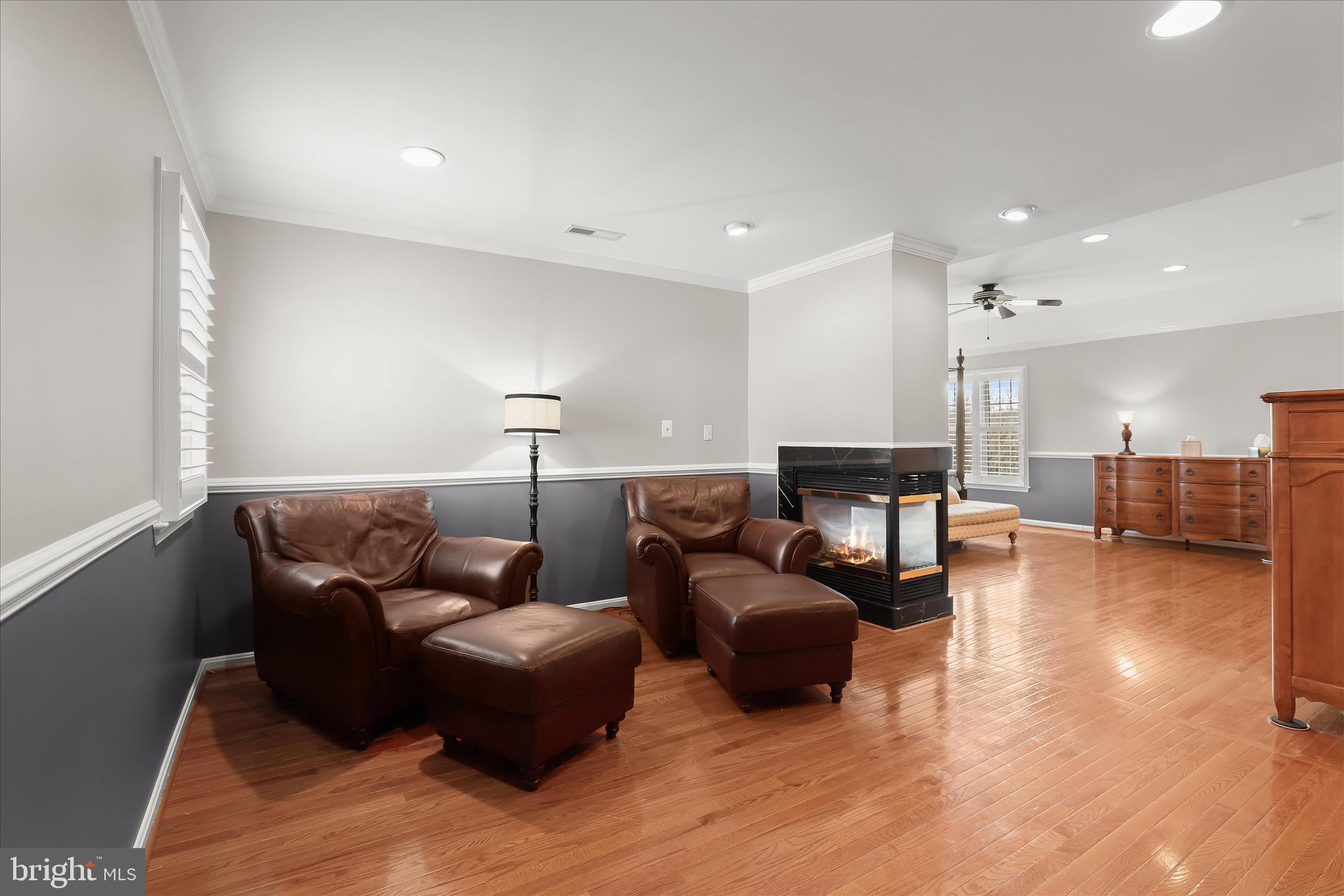 8061 Hunterbrooke Lane Fulton, MD 20759 - Photo 38 of 90 a living room with furniture and a wooden floor