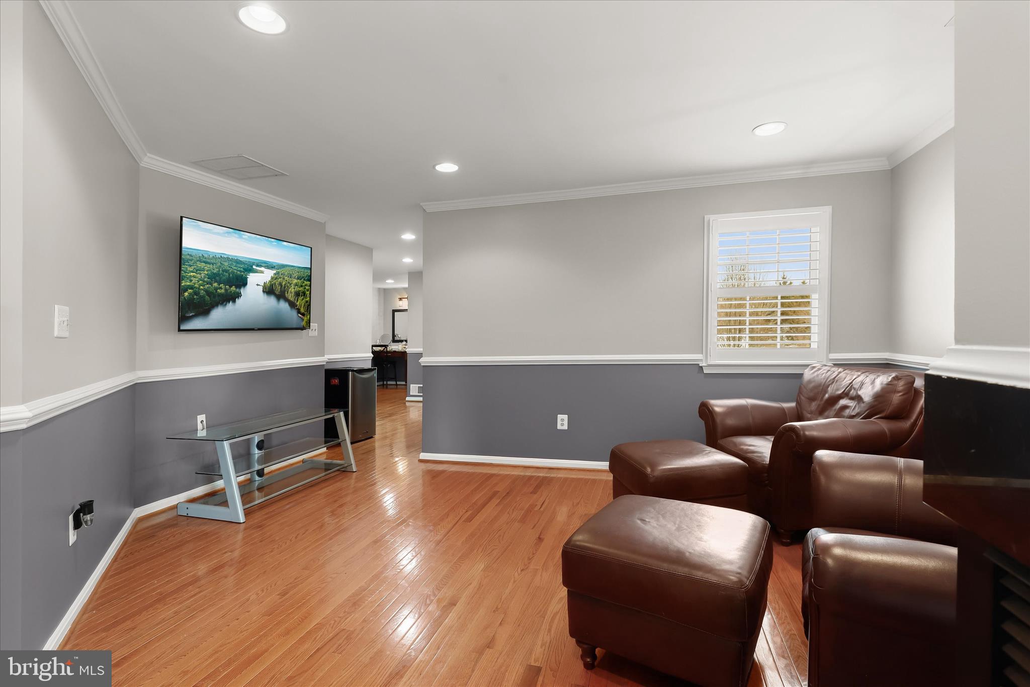 8061 Hunterbrooke Lane Fulton, MD 20759 - Photo 39 of 90 a living room with furniture and a flat screen tv