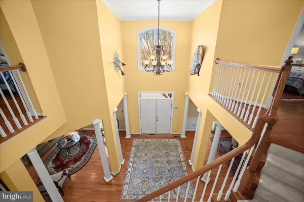 a living room with furniture piano and a window